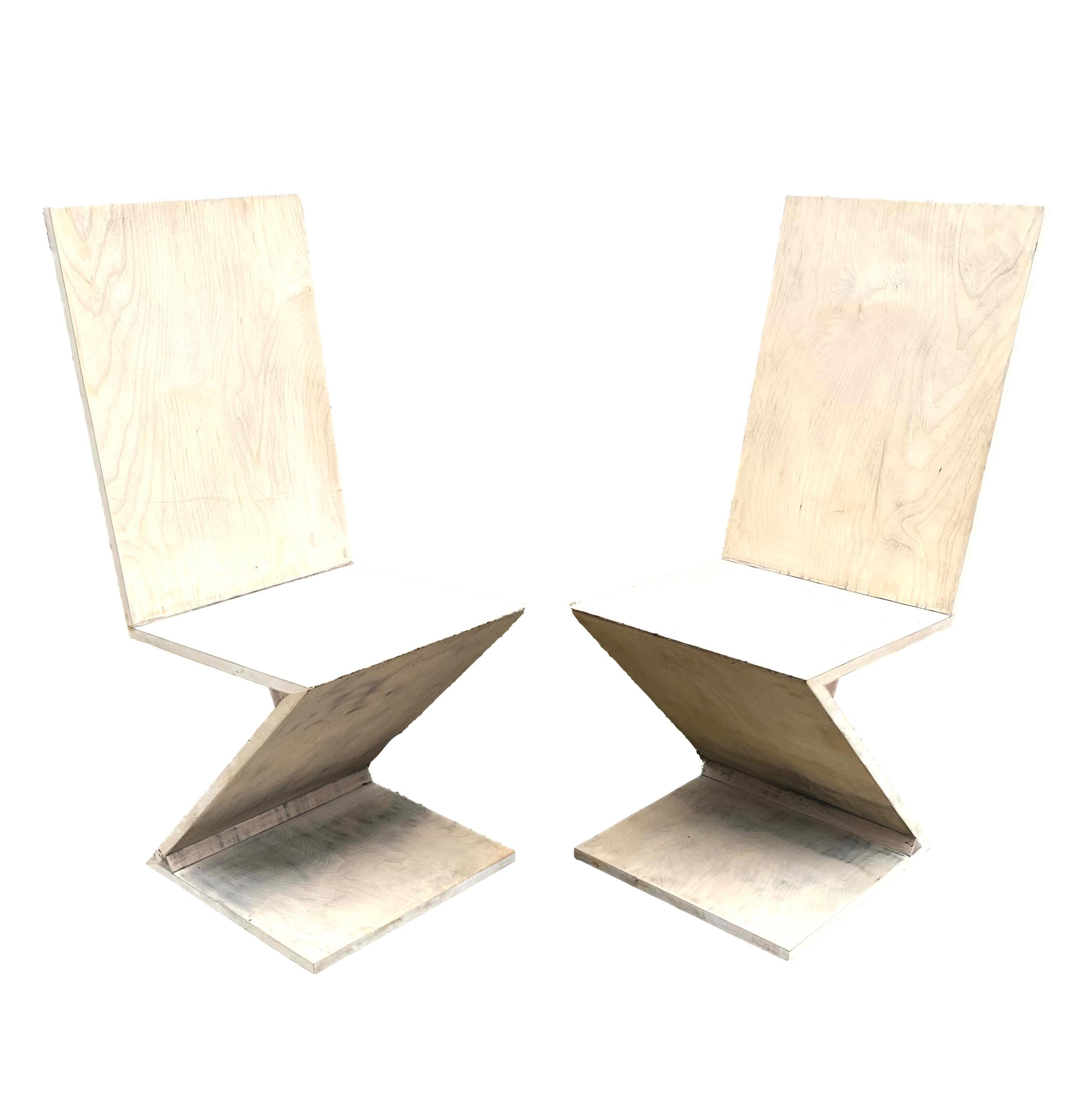 Pair of zig zag chairs in the style of Gerrit Rietveld. Will sell individually.