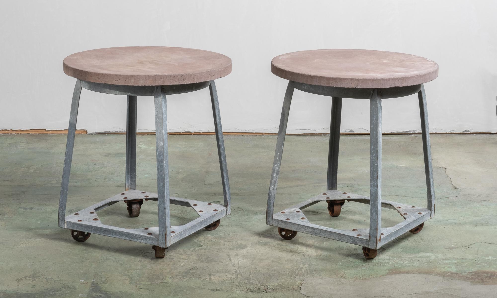 Beautiful industrial forms composed of zinc, with substantial concrete tops, and steel castors.