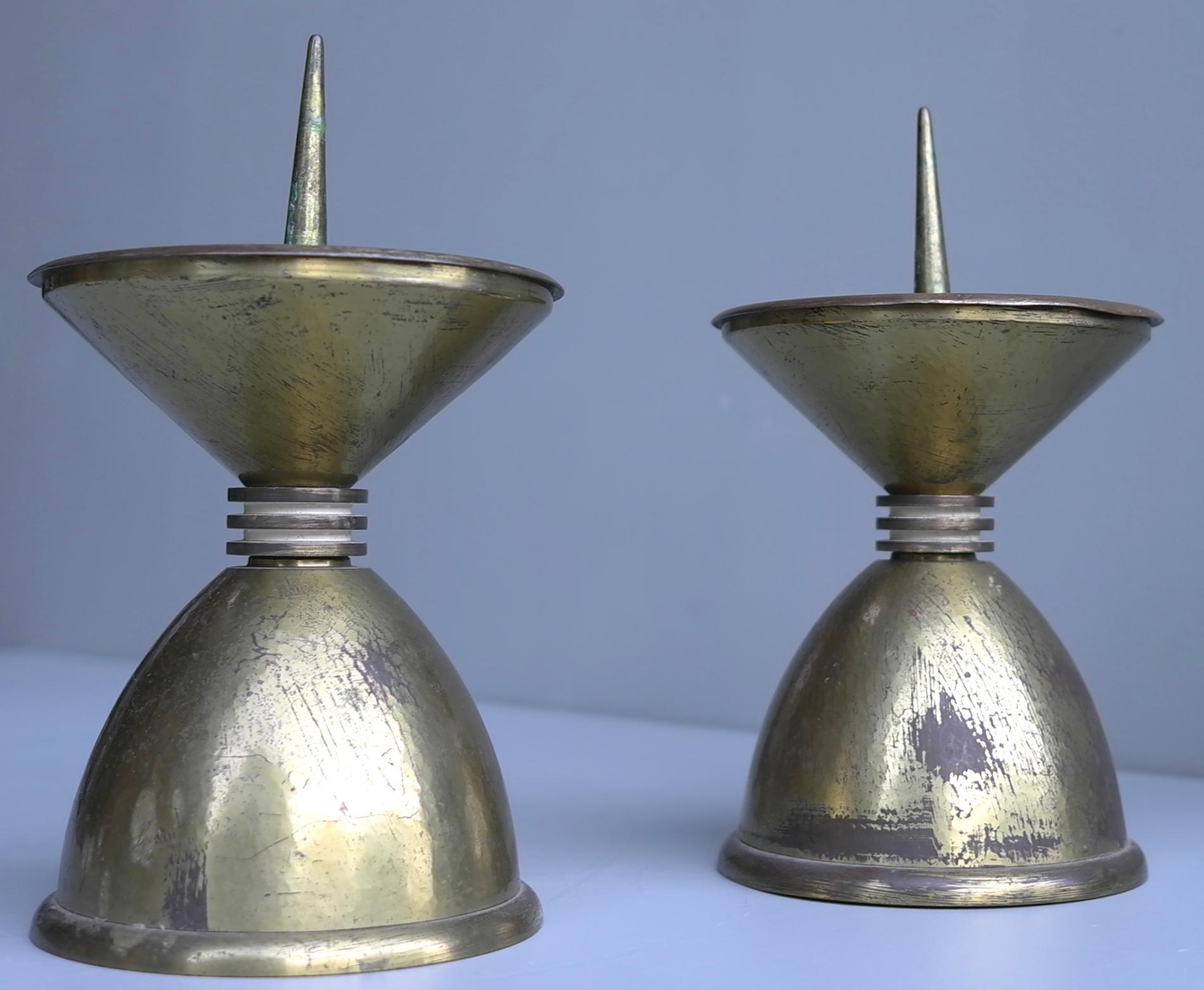 Pair of large Art Deco bronze and brass candlesticks, France, 1930s.