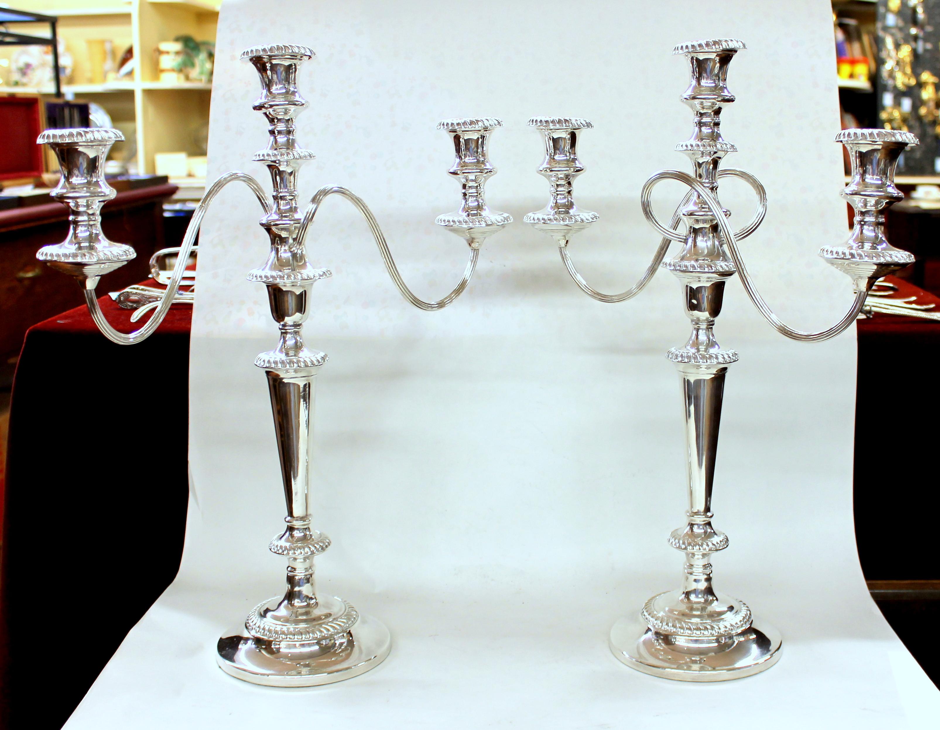 Pair of fine quality old English silver plate Large Gadroon Border Geo. III Style three-light candelabra in the design by Matthew Boulton.
(Maker's marks not found).

18 1/2