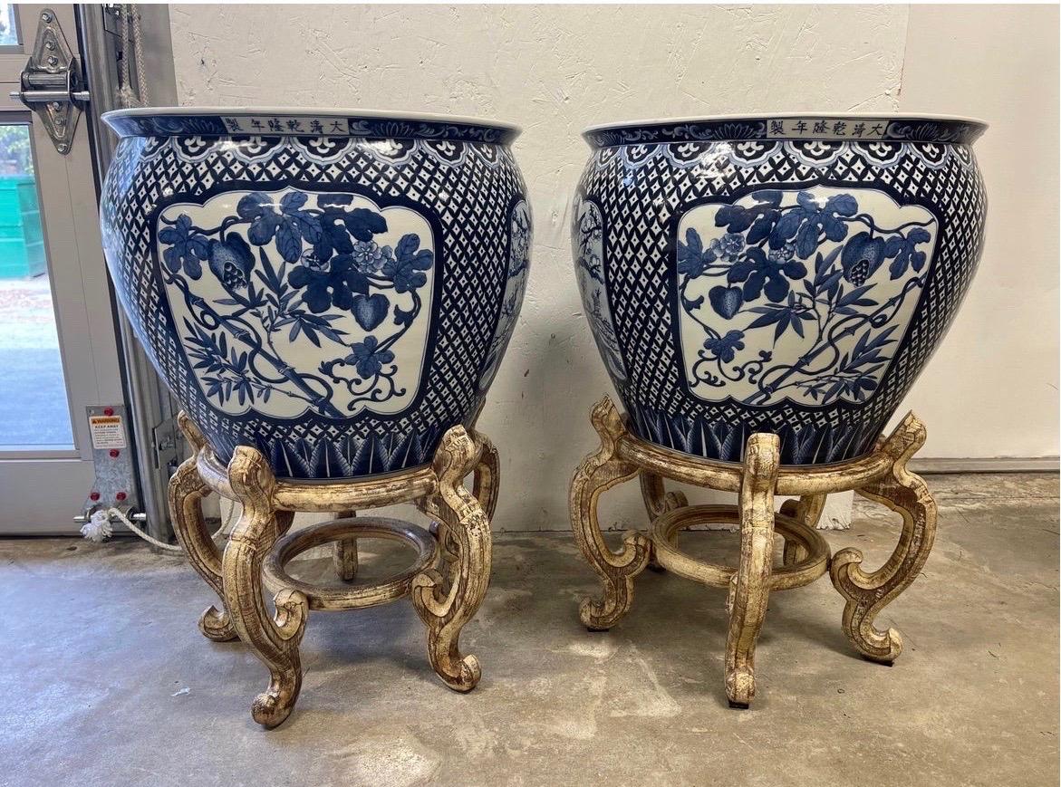 20th Century Pair, Opposing Chinese Export Style Blue and White Jardinieres on Stands