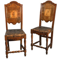 Pair or Set of Seven 18th Century North Italian Commedia del Arte Walnut Chairs