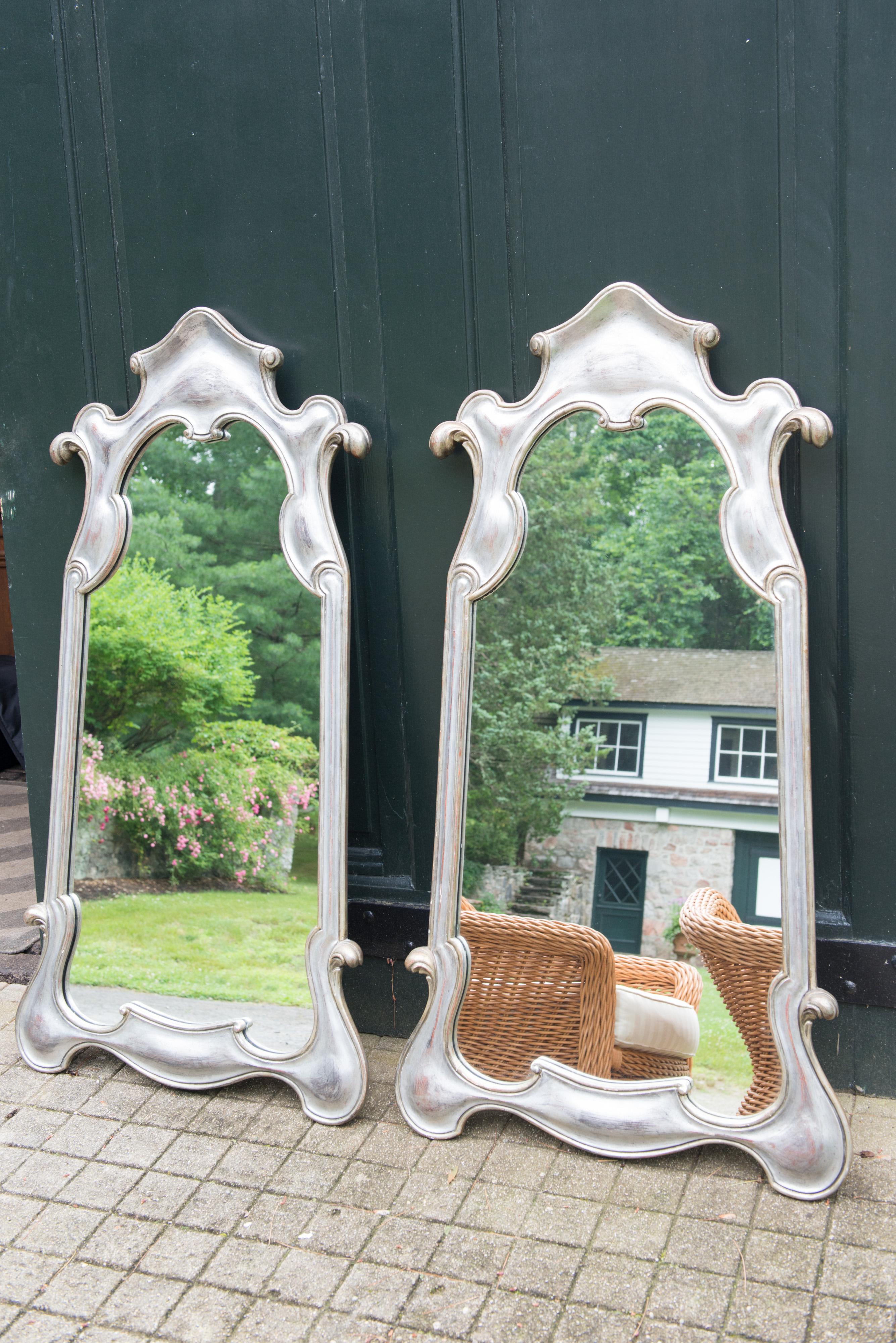 Whimsical Baroque style silver gilt carved wood mirrors from the 1950s. Substantial and good quality.
Marked: Decorative Arts NY. Priced individually.