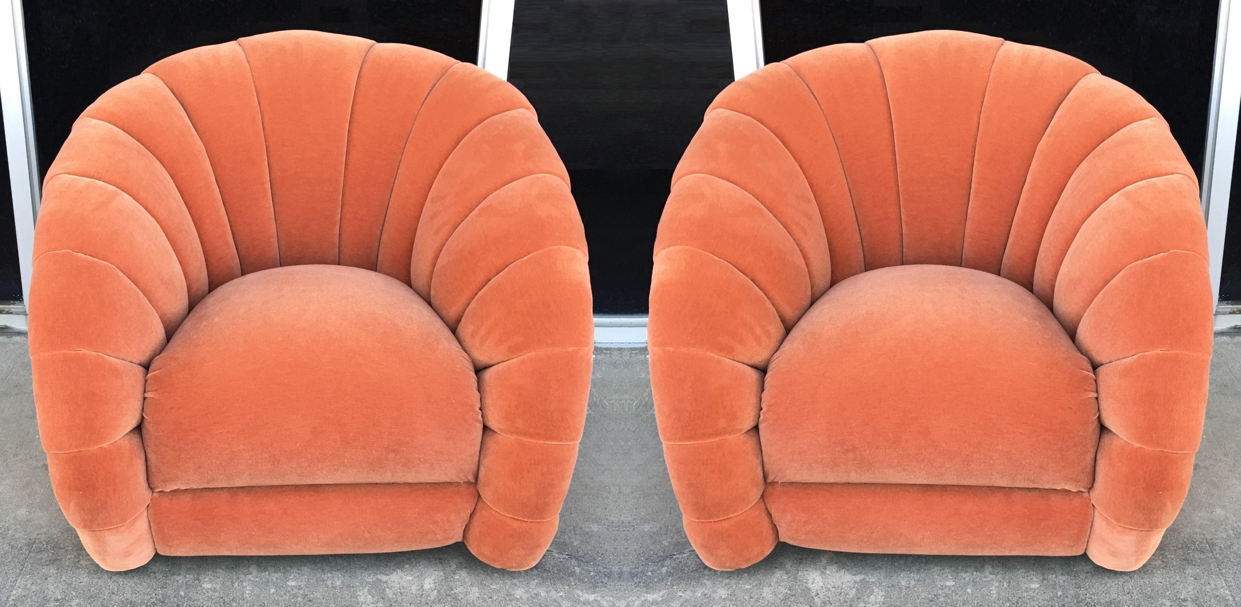 Matching pair of stylish and very comfortable lounge chairs by Vladimir Kagan design for Directional Inc. from the early 1980s. Each professionally custom upholstered swivel chair, barrel back style, covered in an orange velvet fabric. The backs of