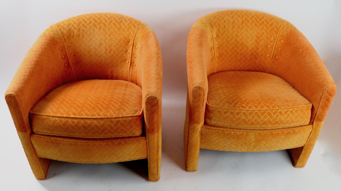 Pair of stylish tub chairs in original orange fabric manufactured by the Century Hickory Furniture Company in the style of Milo Baughman. Both chairs are sturdy and solid, both show variation in color, fading etc to upholstery, usable as is or