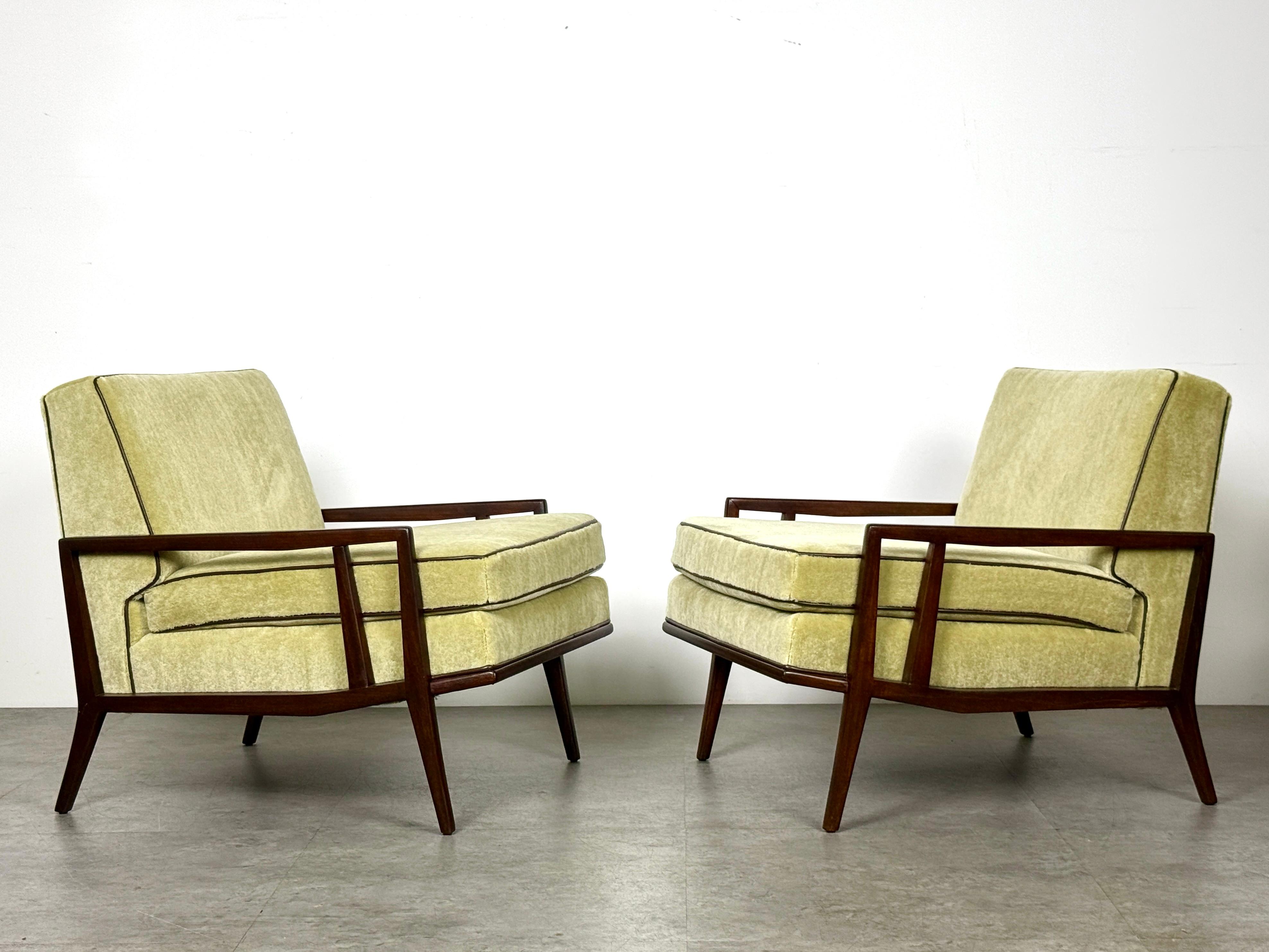Pair of rare angular lounge chairs designed by Paul McCobb
Manufactured by Custom Craft Inc for Directional circa 1950

Architectural low profile design with dark stained mahogany frames
Newly upholstered seats in a pale chartreuse mohair with