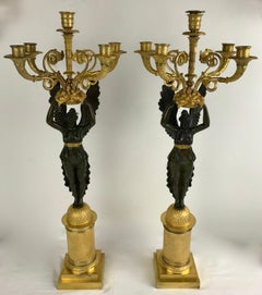 Coppia di candelabri a forma di Nike dell'Impero in ormù e bronzo patinato firmati Meignan