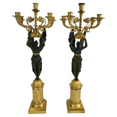 Pareja de candelabros Nike Figurales Imperio de bronce patinado y ormolu firmados Meignan