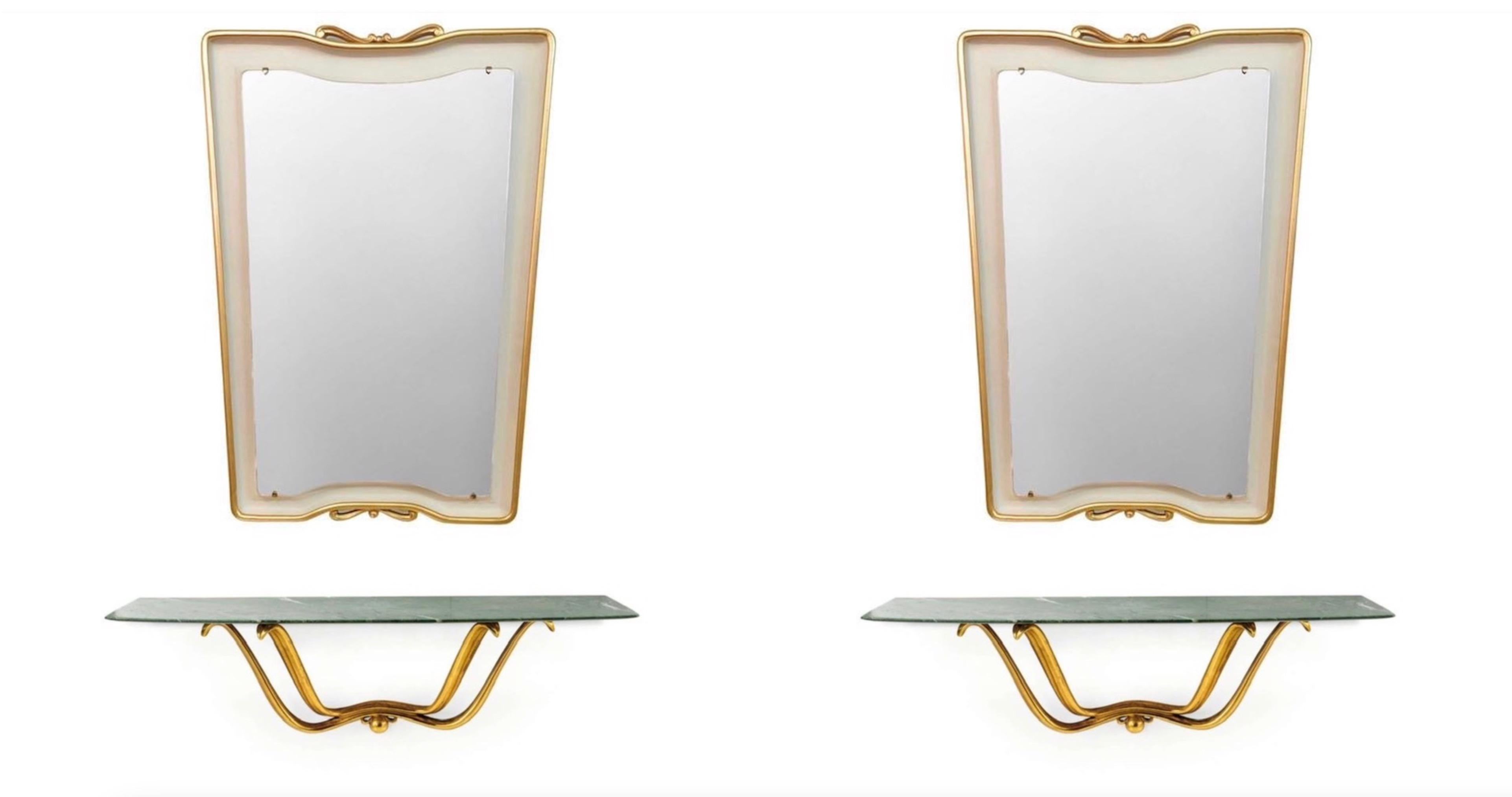 An exceptional and extremely rare pair of trapezoidal mirrors and floating giltwood and marble consoles designed by Osvaldo Borsani 1946. Authenticated by the Borsani Archives.
Hand burnished water gilding on carved wood console frame and honed foil