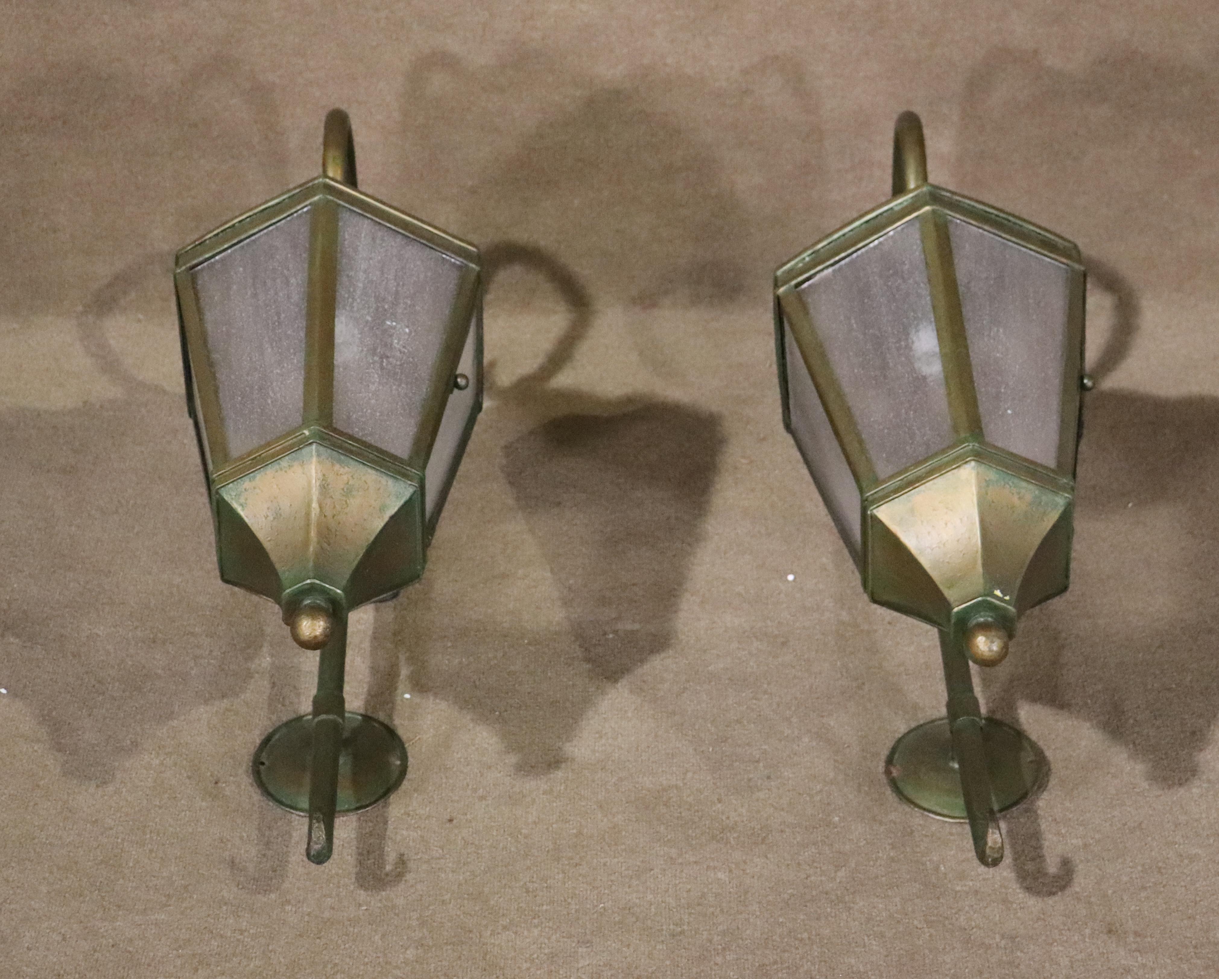 Pair of vintage metal outdoor sconces with glass. Over three feet tall, with handsome age and patina. Ready to light your home entrance!
Please confirm location NY or NJ
