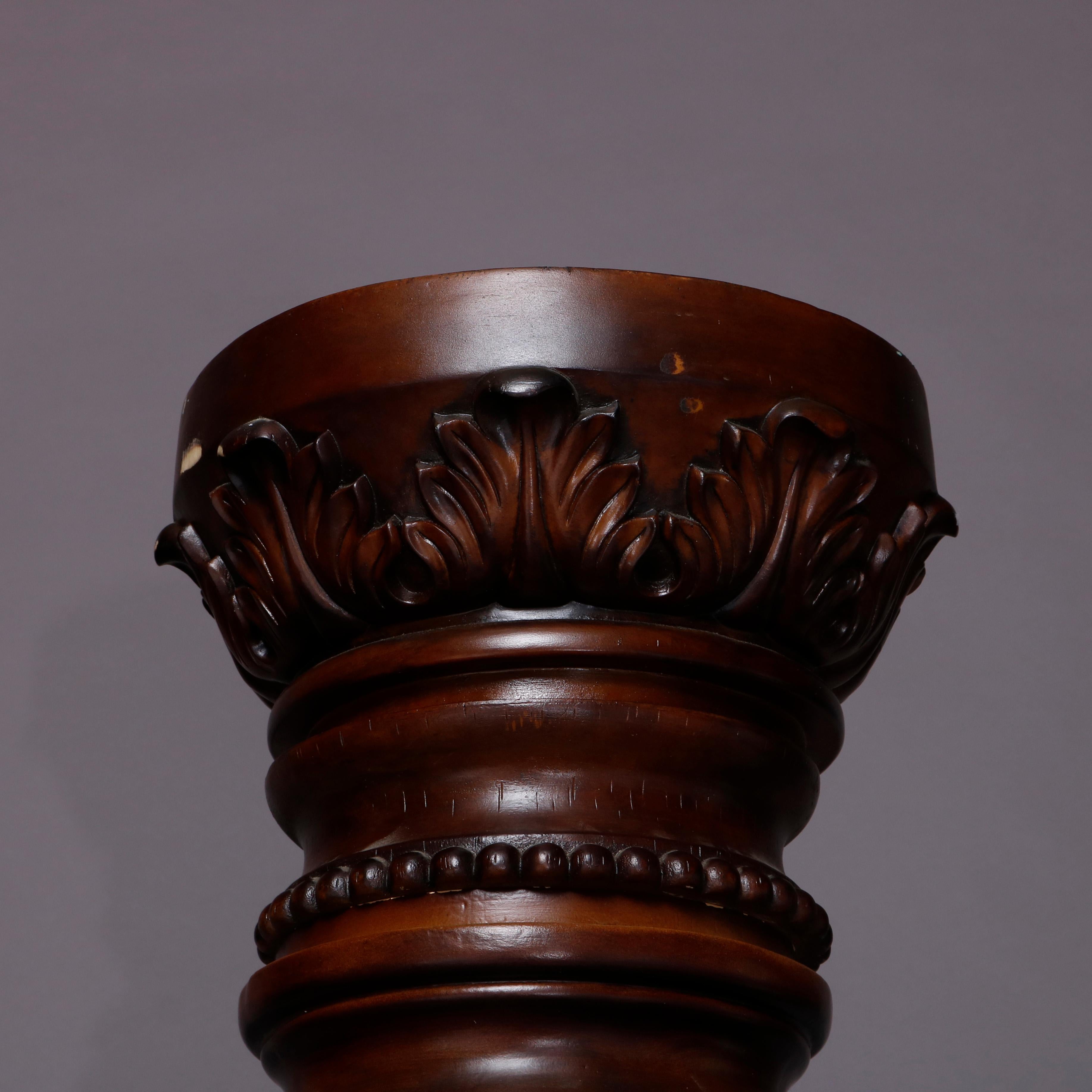 A pair of oversized architectural column offer mahogany and composite construction with twisted foliate decoration and raised on paneled bases, 20th century.

***DELIVERY NOTICE – Due to COVID-19 we have employed LIMITED-TO-NO-CONTACT PRACTICES in