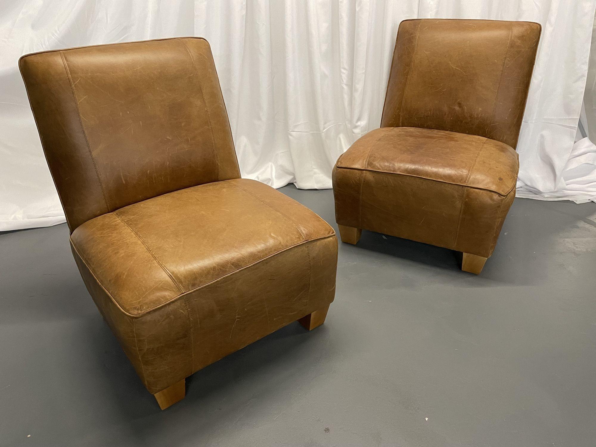 Pair oversized Modern American Designer Art Deco leather lounge / slipper chairs
 
A pair of modern art deco style large leather chairs on low profile bracket feet.
 
Other American designers of the period include Adrian Pearsall, Milo Baughman,