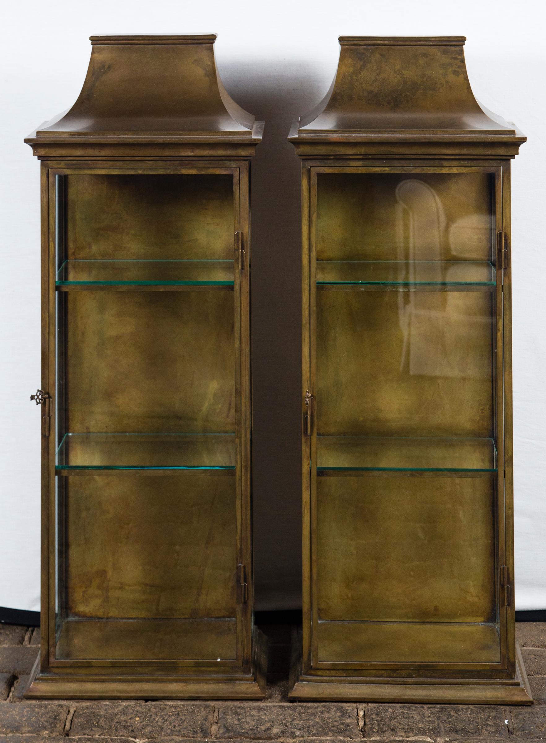 Pagoda style brass vitrine Chapman like quality. Interior shelf: 13.5 by 7 inches. Two hole for hanging on the back of vitrine. Only one available.
