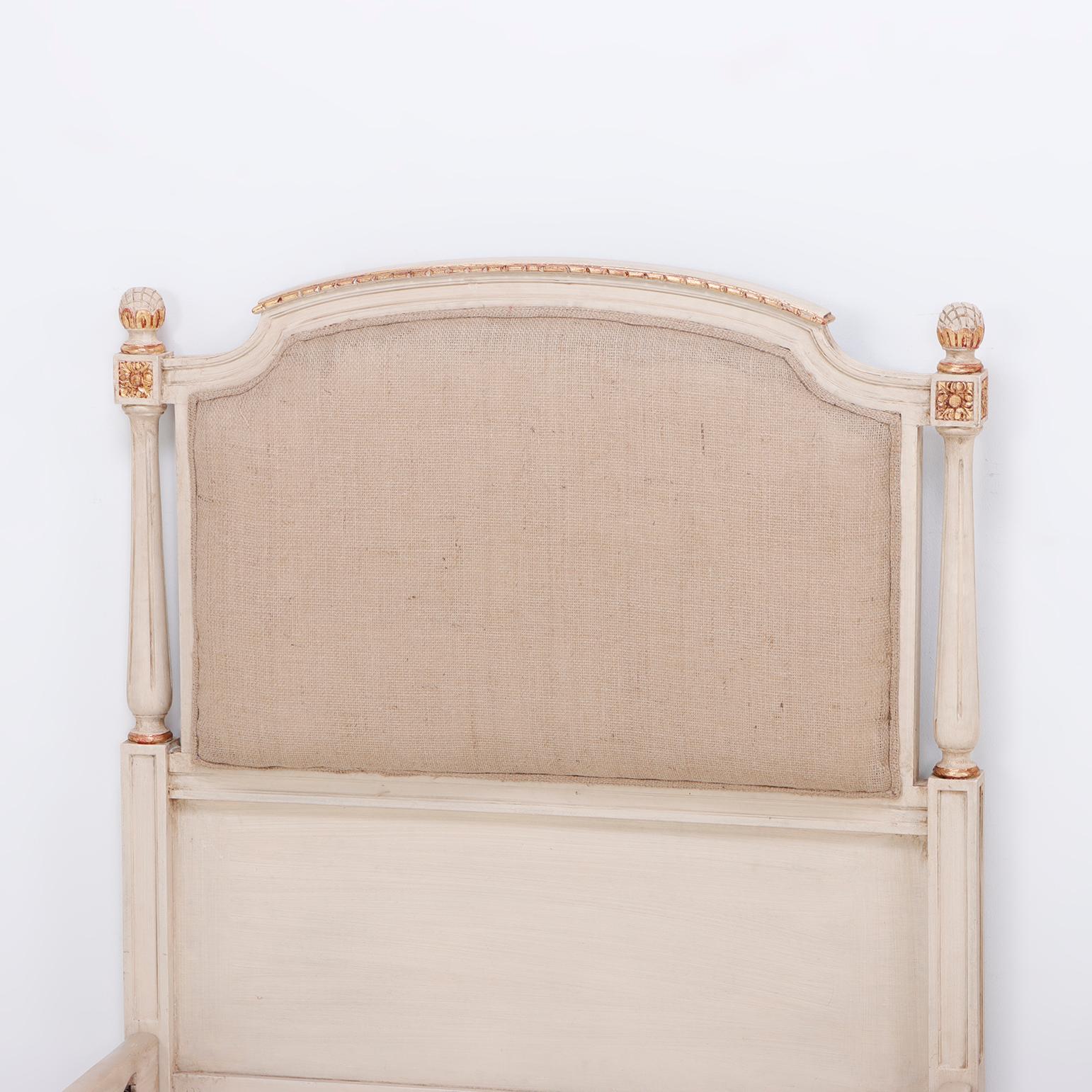 Pair painted and gilt Louis XVI style twin beds C 1940 having been just reupholstered in a burlap like material. They are in excellent condition and ready to be used. interior dimensions are 32