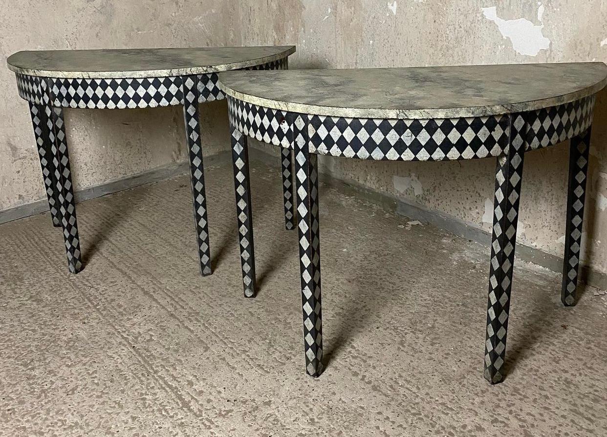 A wonderful pair of half moon side tables, English in origin and dating to the late Georgian period. Now painted in a geometric design with faux marble tops.
In excellent overall condition for the home.
Width 105 cm
Depth 49 cm
Height 72 cm.