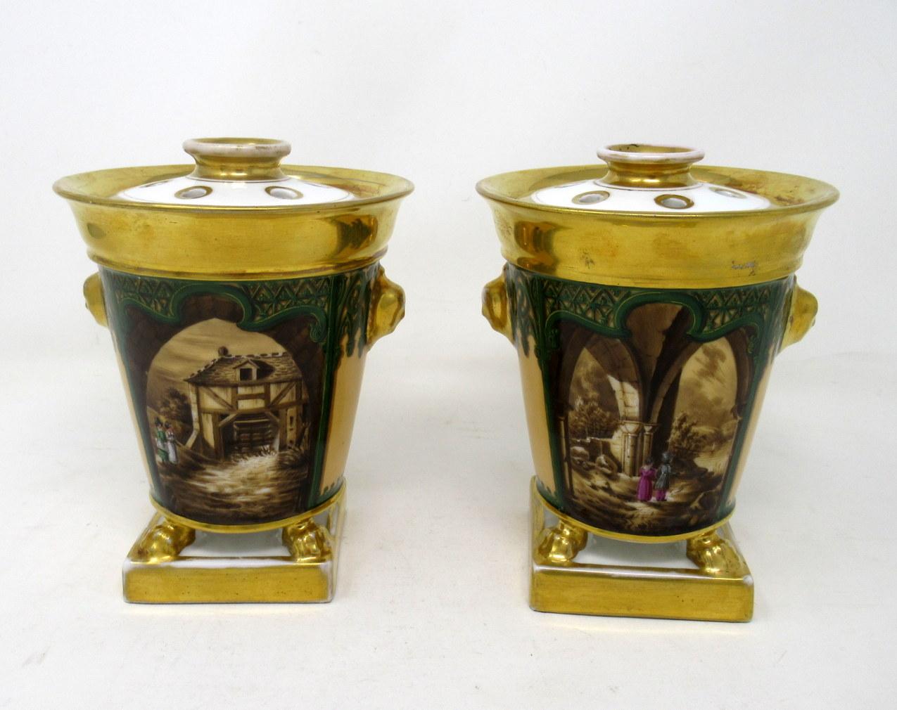 Impressive & rare pair of Paris hand painted porcelain topographical bough pots of compact proportions by Darte Frères. France, circa 1810-1820.

Of flared form with burnished gold everted rims above Gothic decoration in colors of green and brown