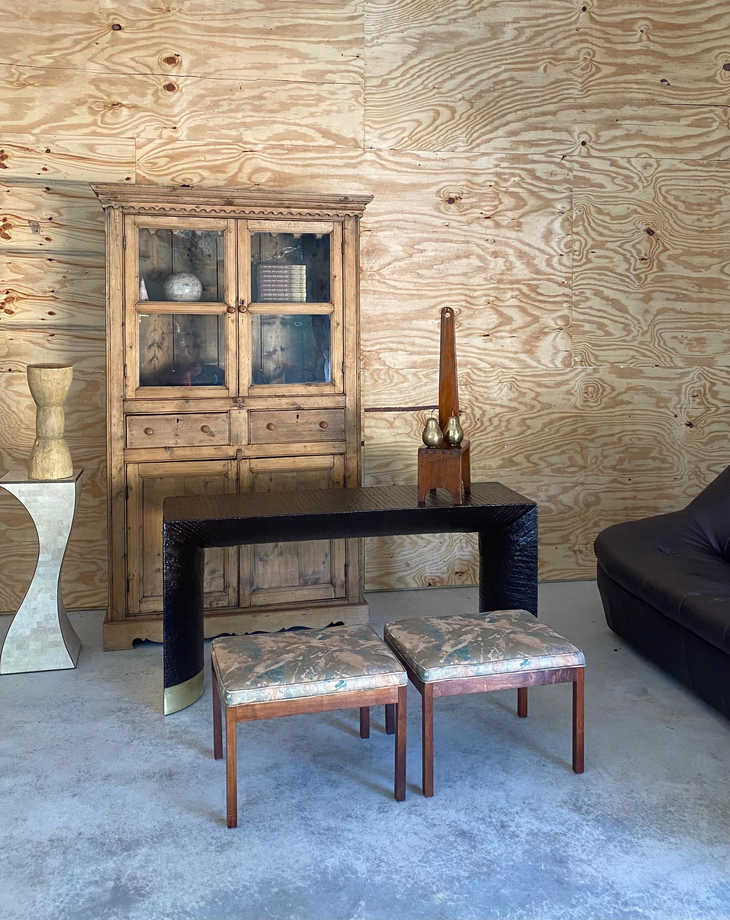Minimalist pair of upholstered stools in the style of Harvey Probber, circa 1960s. 

Austere and rectilinear in form, these stools are the perfect ottomans in front of lounge chairs and can be tucked away under a console table when not in used.