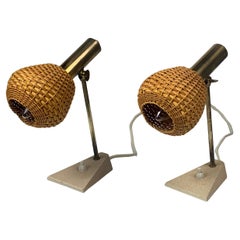 Pair patinated brass and rattan bedside lamps, travertine base, 1960s