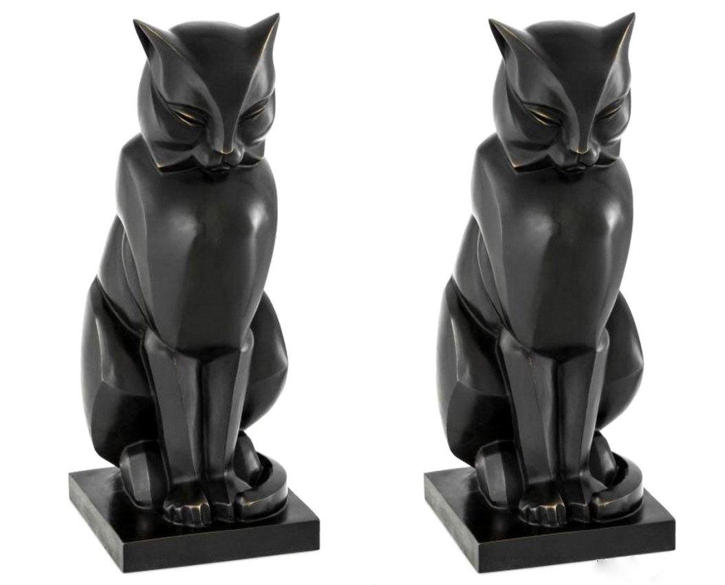 An Exceptionally Stylish Pair of Patinated Bronze seated Cats, modelled in the Art Deco Style, after a model by Swiss animalier sculptor and painter Eduard Douard Marcel 1881-1971 

Condition: Mint condition with no imperfections.  

Height: 18”