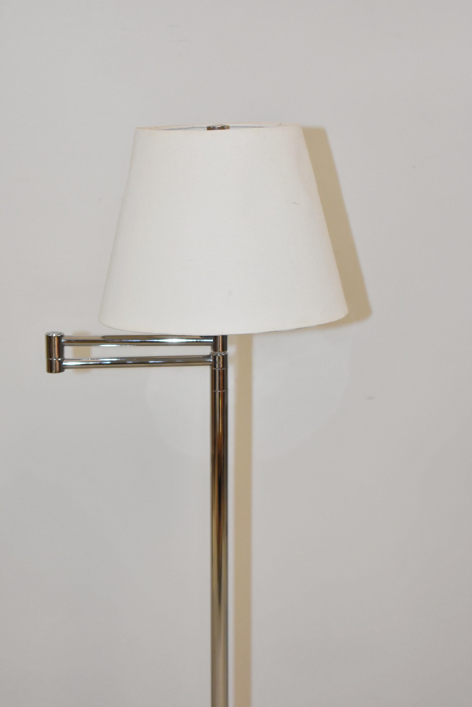 Pair of vintage chrome finished swing arm floor lamps by Paul Hansen of New York. 52