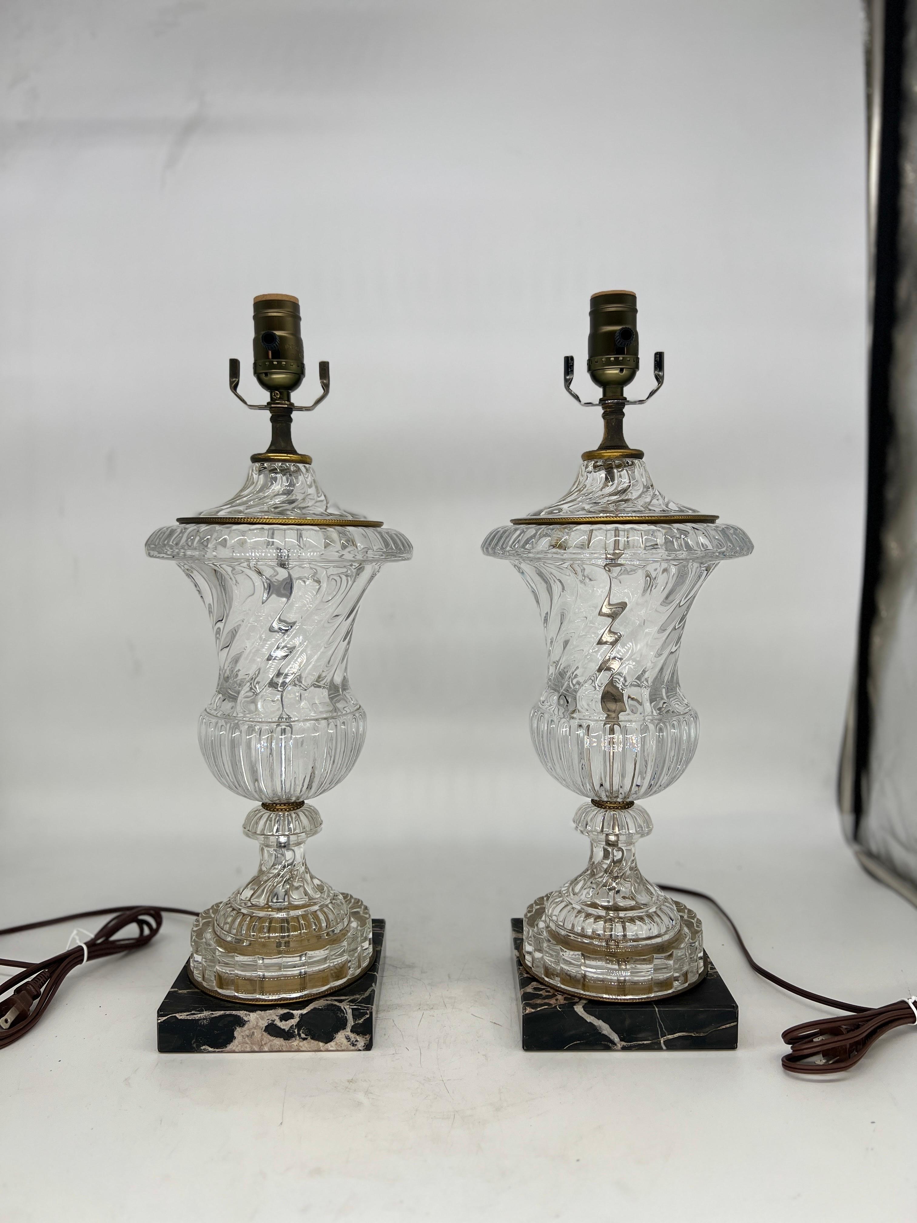 Paul Hanson, 20th century. 

Elevate your living space with this exquisite pair of Paul Hanson Baccarat style table lamps, expertly crafted to harmonize opulent design with timeless elegance. These lamps exude a luxurious aura through their
