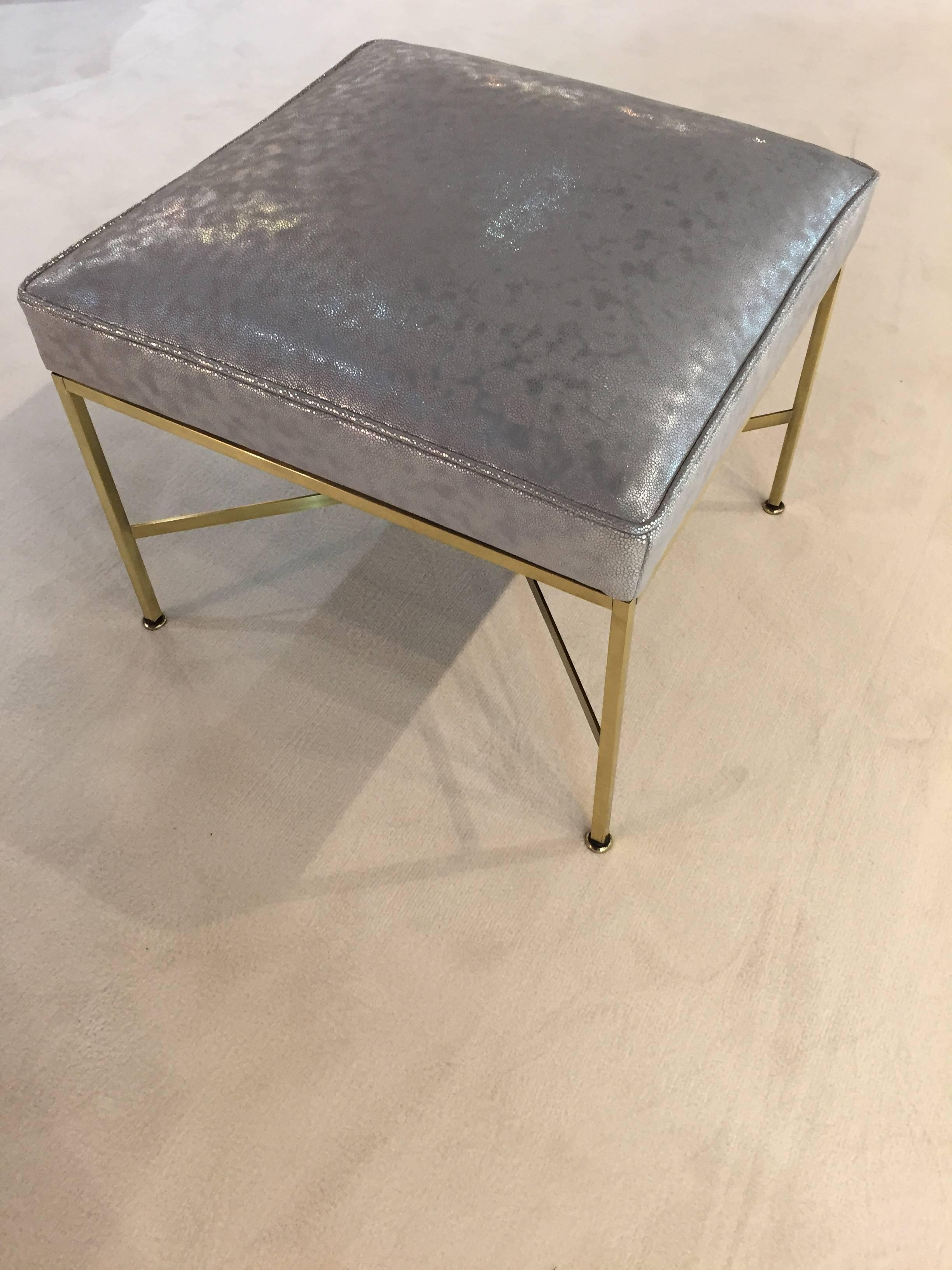 Pair of Paul McCobb brass stools, shagreen silver leather, with brass criss-cross bases, adjustable feet.