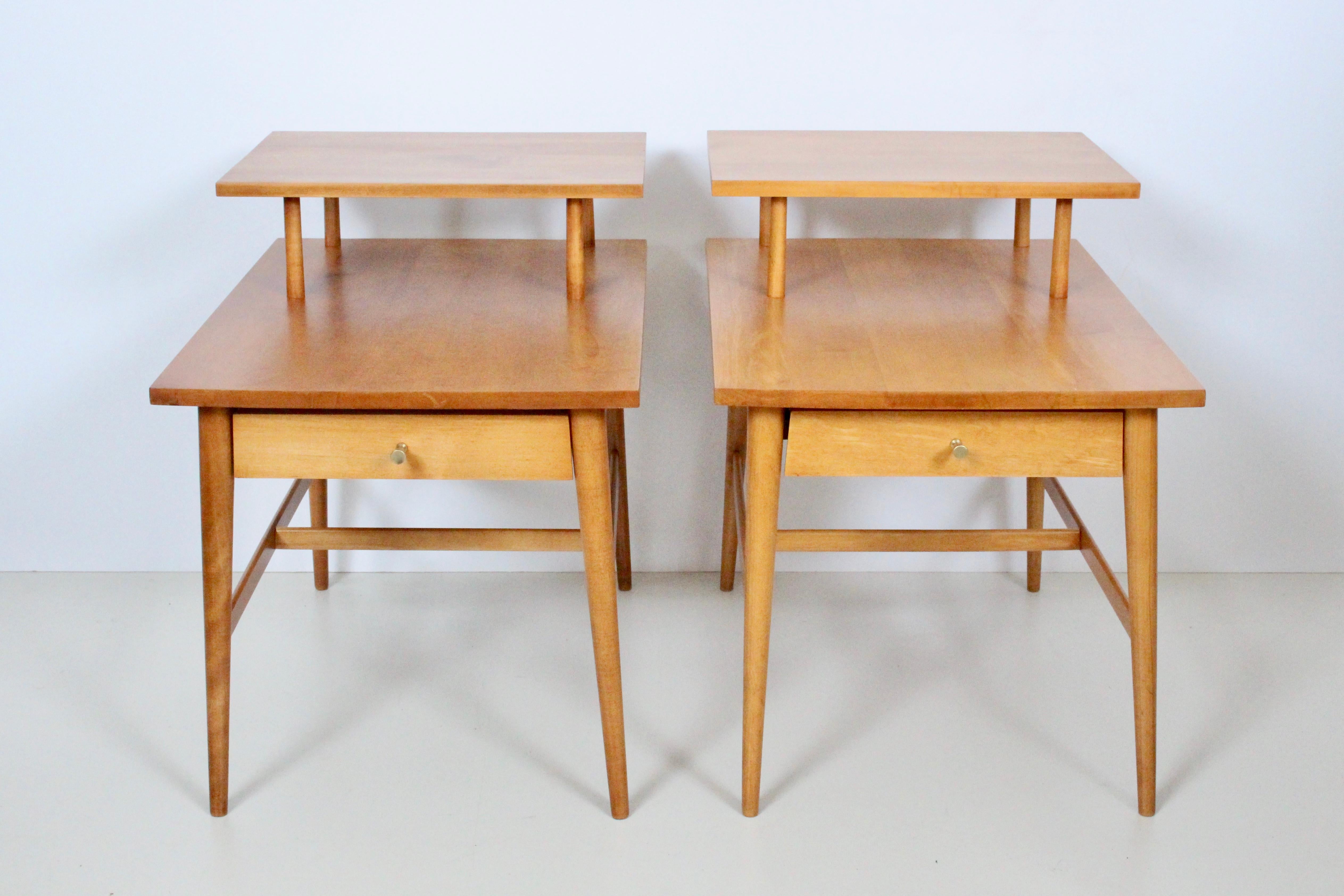 Pair Paul McCobb for Planner Group, Winchendon Furniture #1589 Step Tables, 1950s-1960s. End Tables. Side Tables. Nightstands. Featuring solid two-tier rectangular form, deep single drawers with signature McCobb hourglass pulls. CLassic American Mid