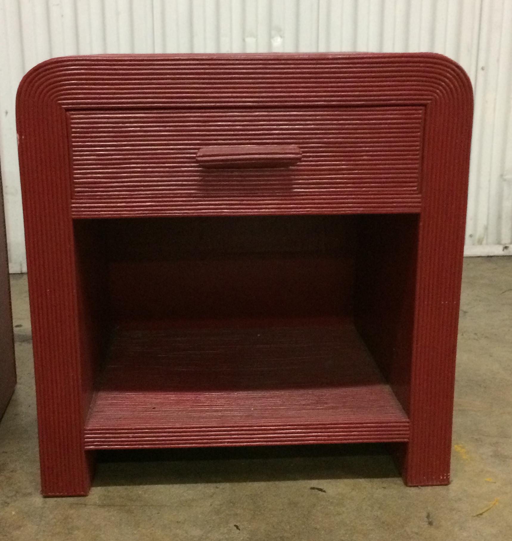 From the 1980s pencil reed rattan night stands or end tables. Very solid construction each with a single drawer with storage below. Vintage red Paint. Will go with many different styles from shabby chic, Bohemian or Hollywood Regency.