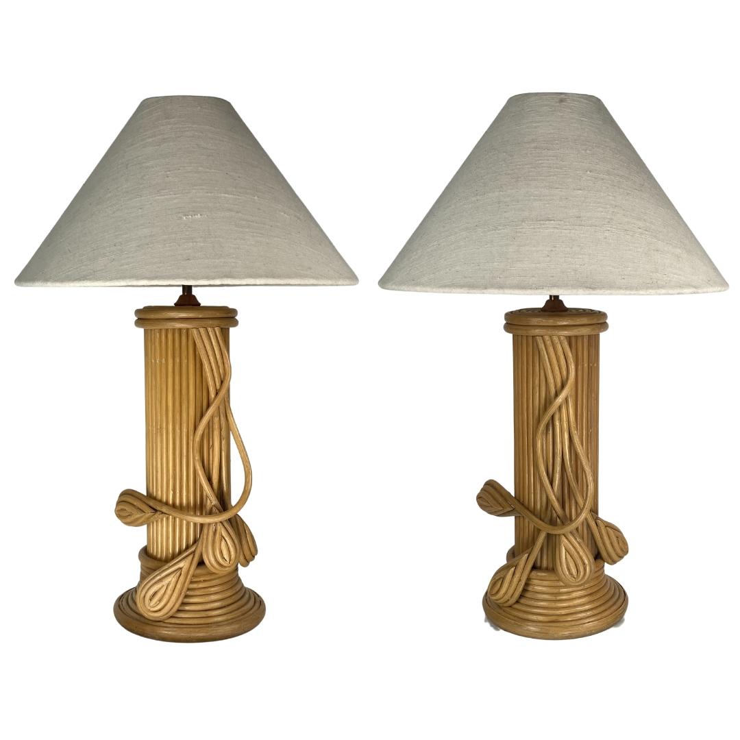 Wonderful set of 2 large pencil reed Italian rattan table lamps dating from the 70s often attributed to Vivai del Sud and somewhat in the style of Gabriella Crespi. These lamps are in great condition with only some light wear but with no real flaws