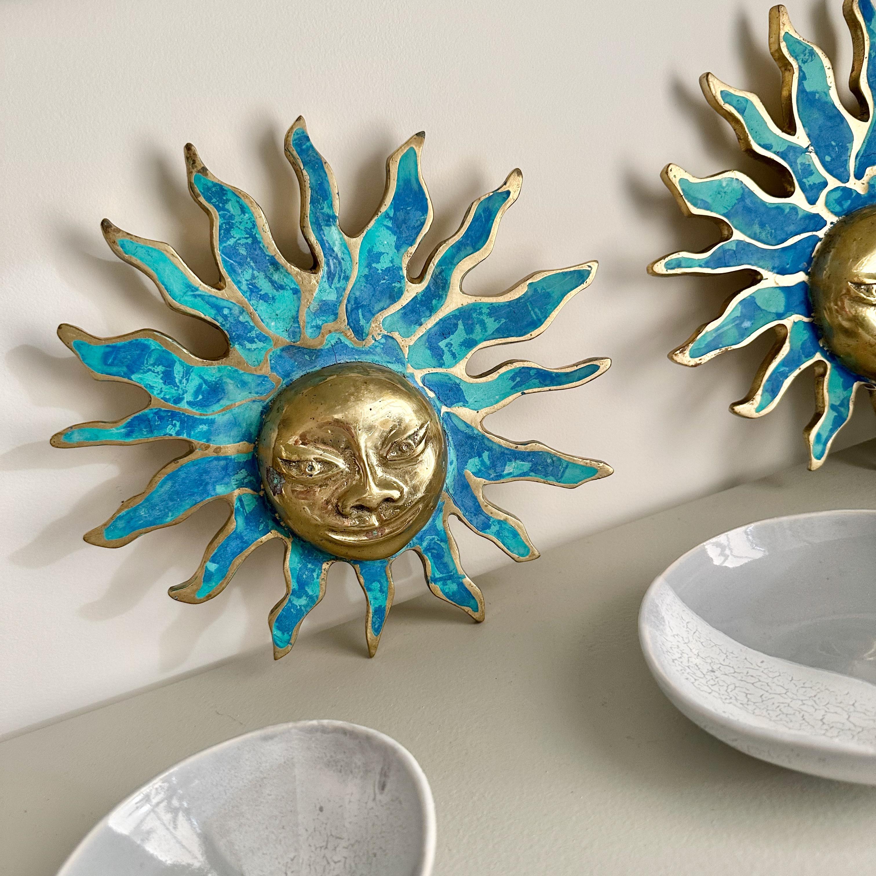 Pair of signed Pepe Mendoza sun face door pulls or handles.
Turquoise green malachite enameled stone set within cast bronze sun with brass face.
10 inches diameter. 
Rasplandor - 'a contemporary interpretation of an ancient sun god. Due to the smile