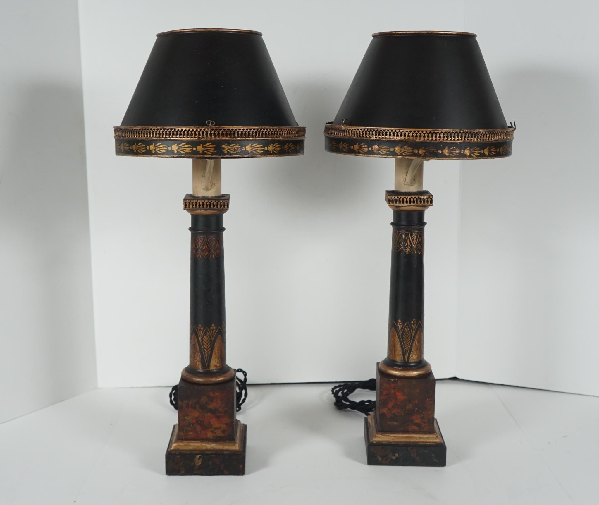This very good pair of oil, lamps now wired for electricity, were made in France circa 1815. Originally having glass shade they currently have tole shade that appears to have been fitted to them in the first quarter of the 20th century. The lamps