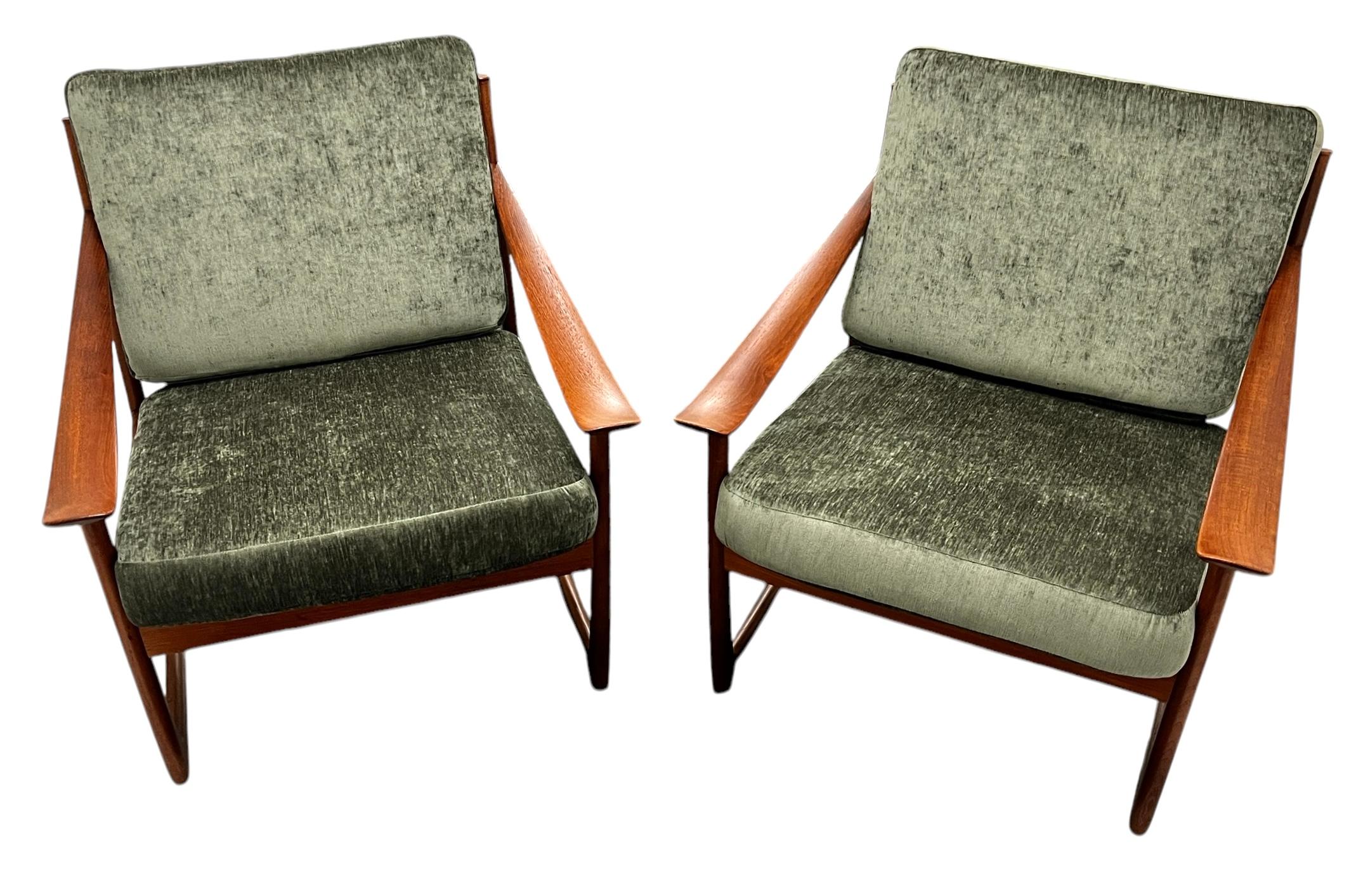 A gorgeous Pair of Vintage Mid-Century Danish Teak Lounge Chairs designed by Peter Hvidt and Orla Molgaard-Nielsen for France & Son, imported for John Stuart Furniture. Model FD-130.  The chairs are in excellent vintage condition with very minor
