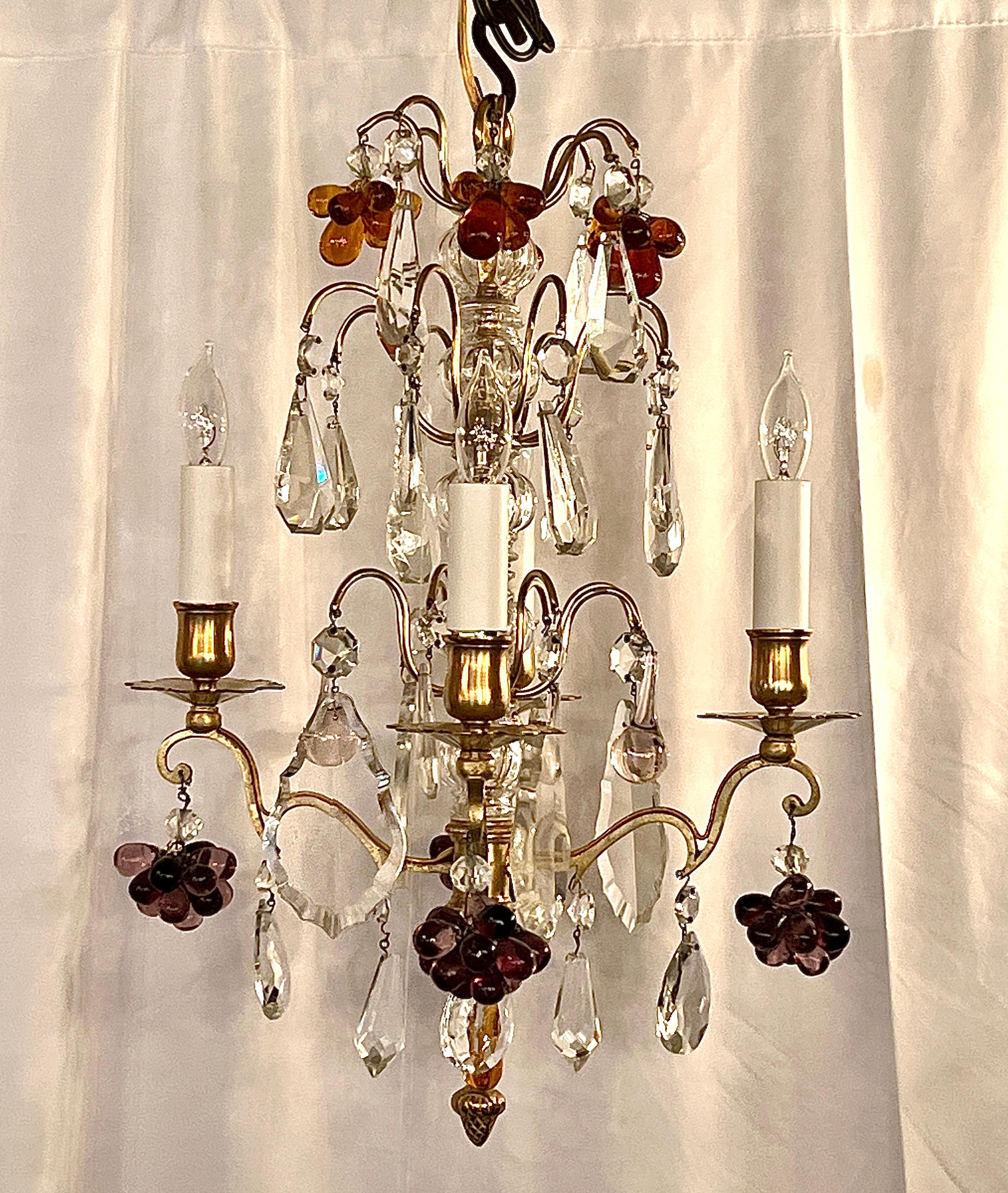 Pair Antique French Baccarat Crystal & Bronze D'ore Chandeliers, Circa 1890's
Sweet and Petite chandeliers with colored crystals, clear crystals and a cut crystal stem on a gold bronze frame.
