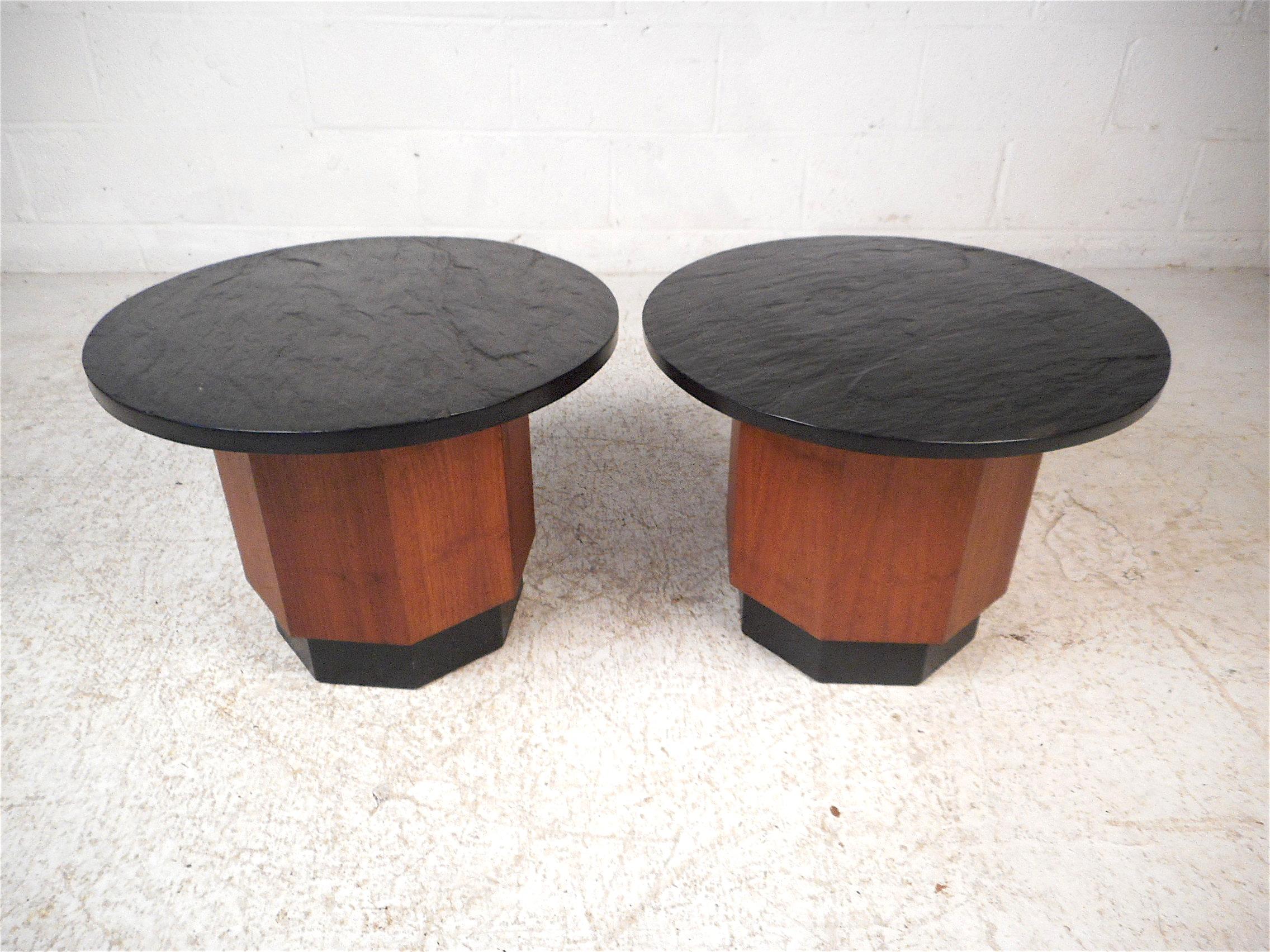 Stylish pair of midcentury tables with slate tops. Octagonal wooden pedestals with a black trim accent on the bases. Sure to impress in any modern interior. Please confirm item location with dealer (NJ or NY).