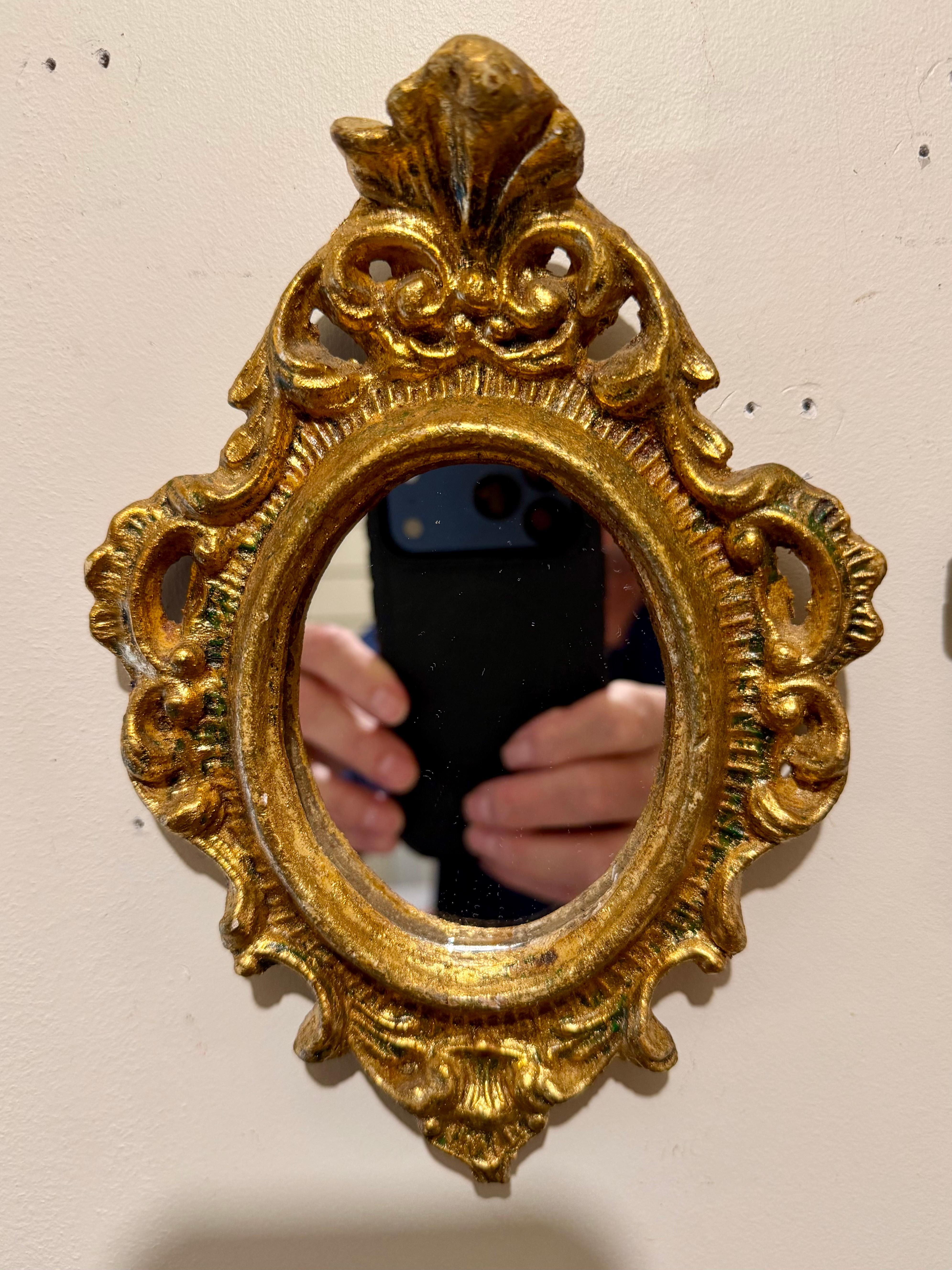 Great petite pair of vintage Hollywood Regency style giltwood Italian Florentine mirrors. Good condition with newly replaced mirror. Measures 8