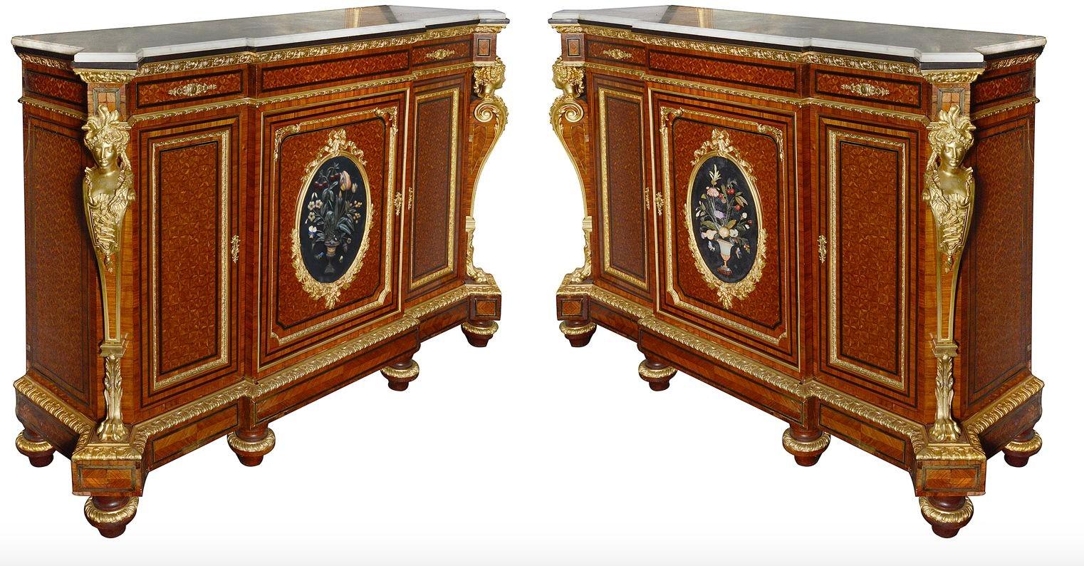 An imposing and impressive fine quality pair of French 19th Century marble topped side cabinets. Each with wonderful gilded ormolu mouldings, mounts and monopodia embellishments to the corners. Parquetry veneers to the three inset panelled doors and