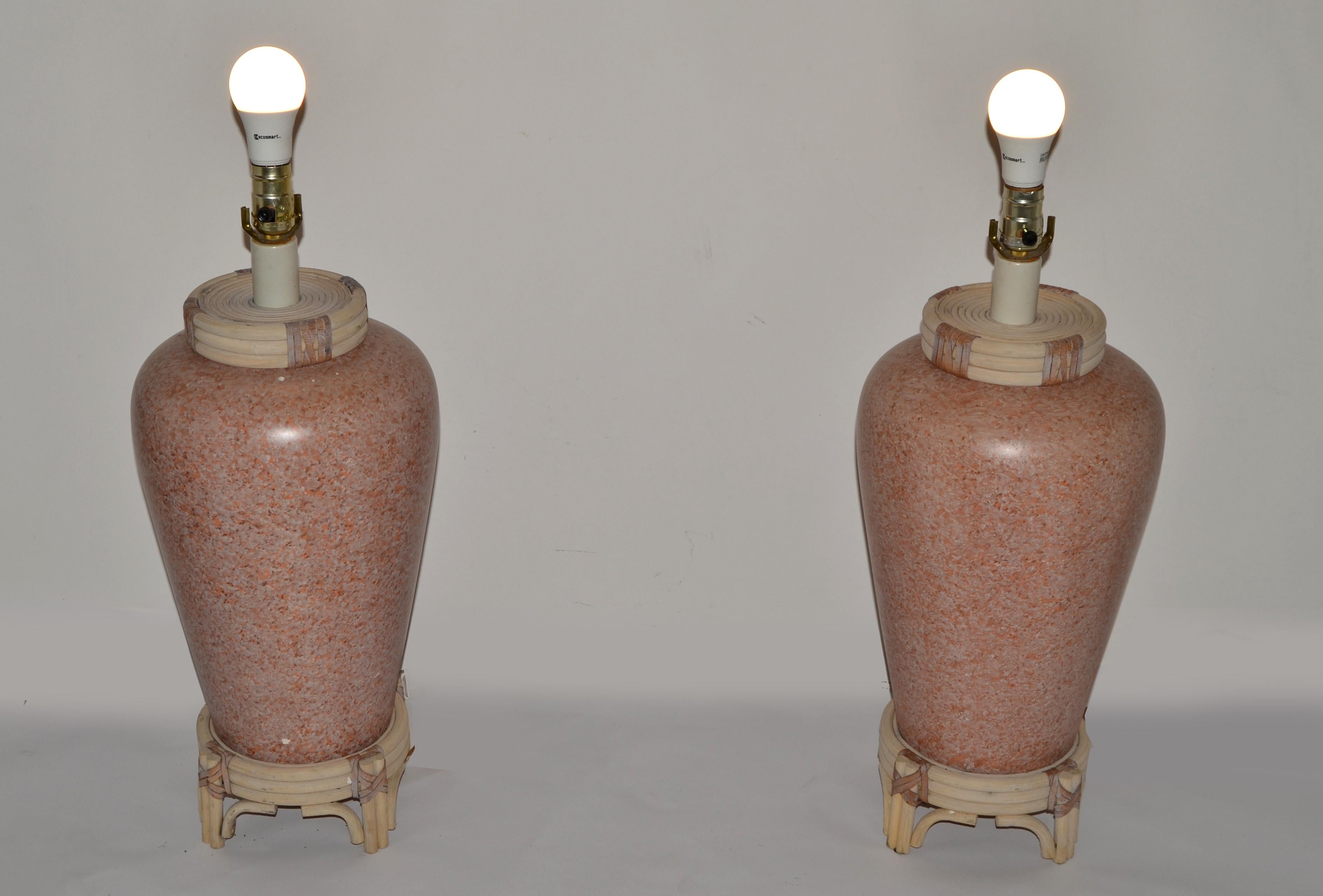 Beautiful Pair of Pink Terrazzo Style Ceramic Table Lamps with handwoven Bamboo Decor and Taupe Leather Accent.
Asian Chinoiserie Style with a touch of McGuire Manner of binding the Bamboo with the Leather.
US Wiring and each Lamp takes a regular or