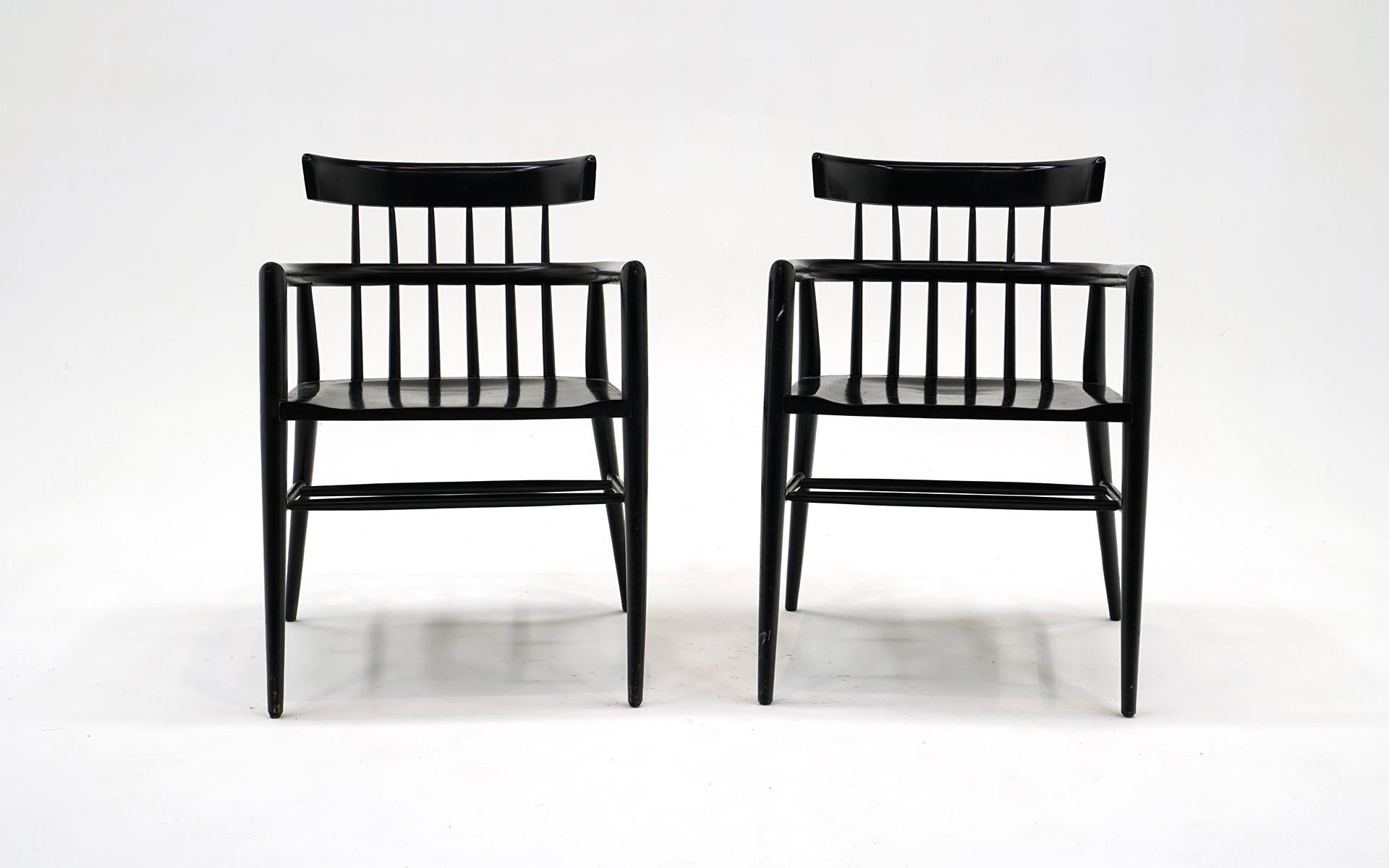 Pair of Paul McCobb Planner Group Arm Chairs.  Solid Maple construction with original black lacquer finish.  Original condition with wear.  Structurally sound and ready to use.