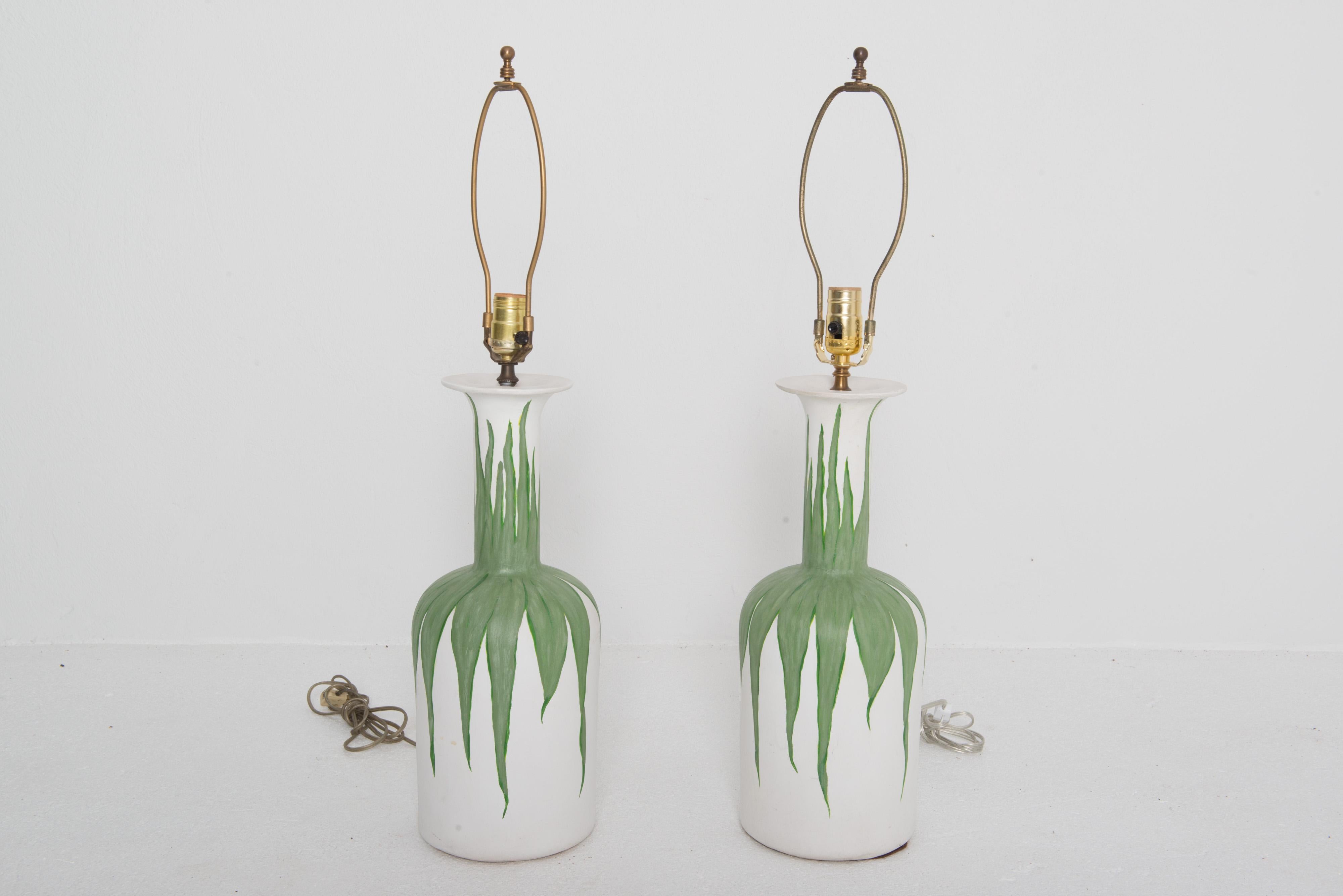 Pair of organic modern hand painted green foliated white plaster lamps. 
Large scale. Includes harps and finial. No shades.