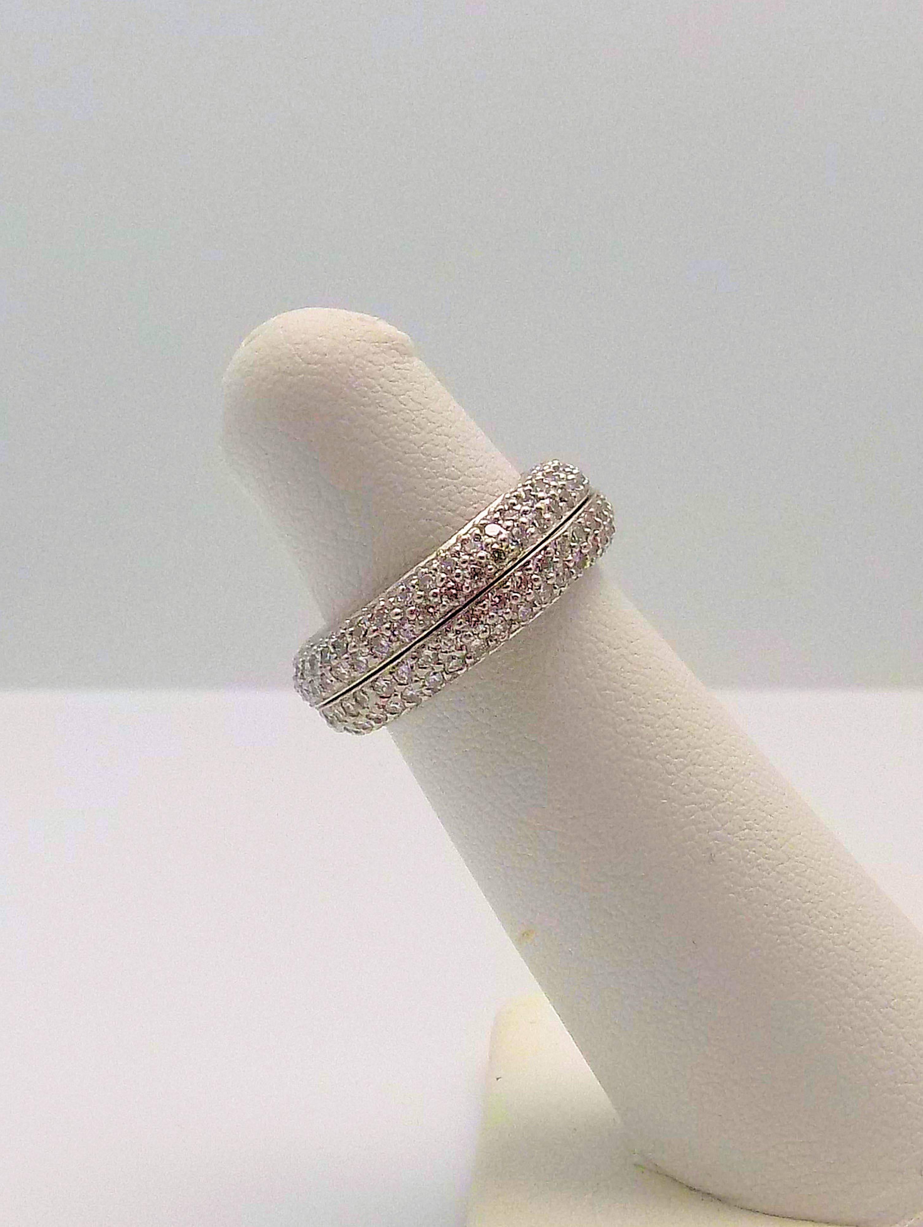 Platinum Pave' Eternity Bands, 1/2 Round, 230 Round Brilliant Diamonds 1.50 CT TW, VS, G, Finger Size 4, Signed: Matthew Trent. 7.8 DWT or 12.13 Grams.

About MATTHEW TRENT: Preston Hollow jeweler Matthew Trent has seen it all in his 30 years of