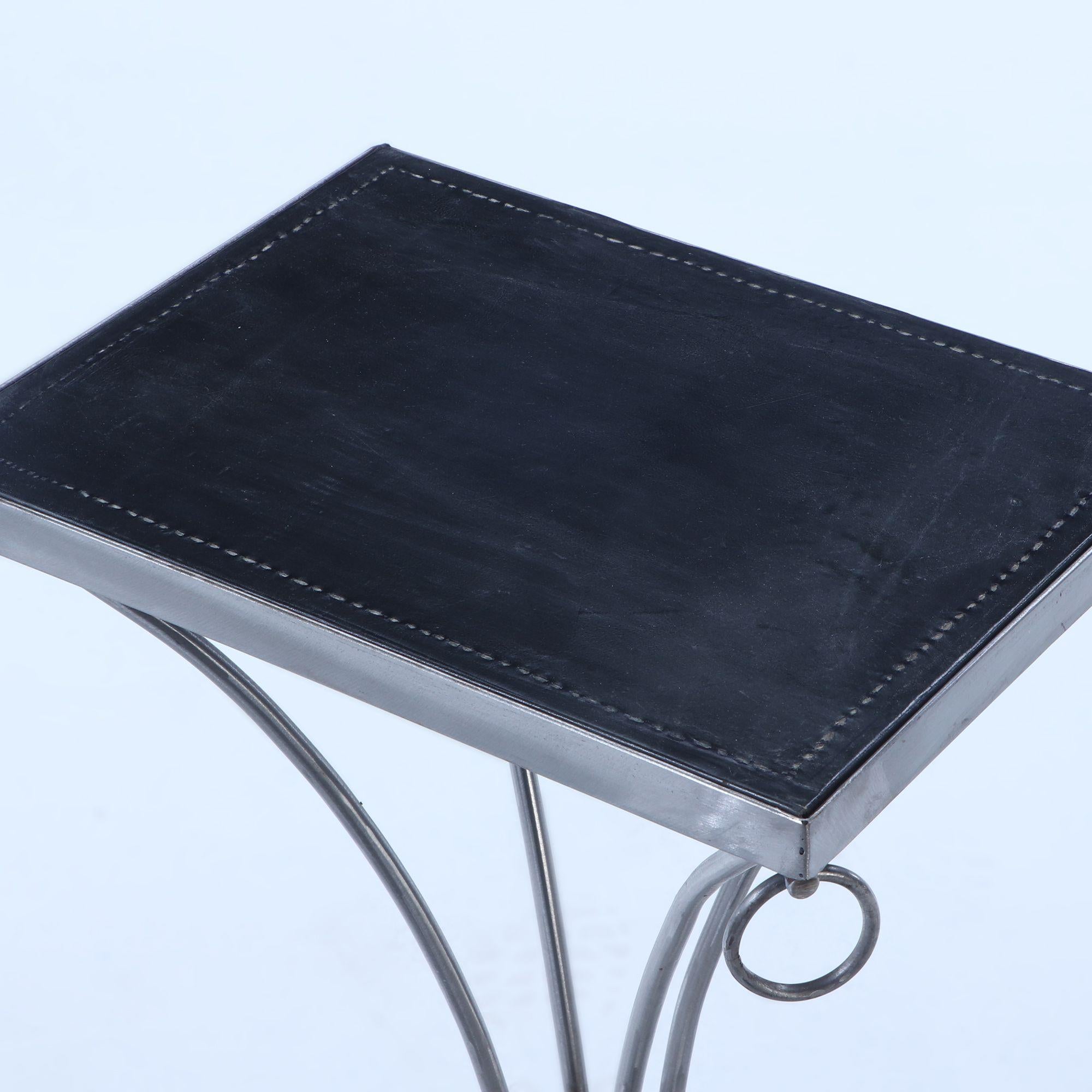 Contemporary Pair polished iron drinks tables with ring decoration and distressed leather For Sale