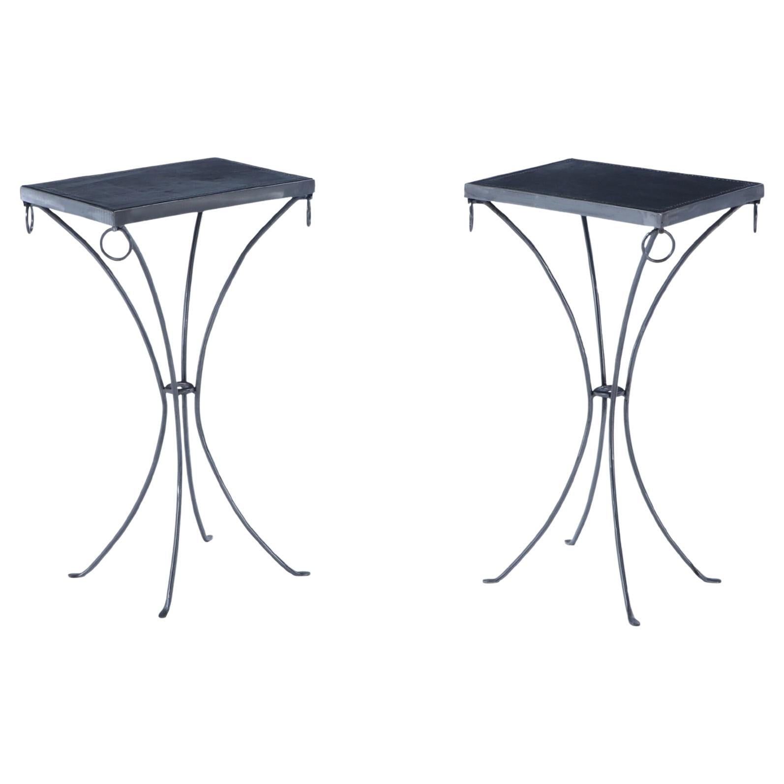 Pair polished iron drinks tables with ring decoration and distressed leather For Sale