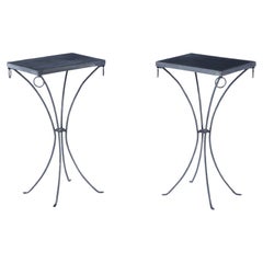 Pair polished iron drinks tables with ring decoration and distressed leather