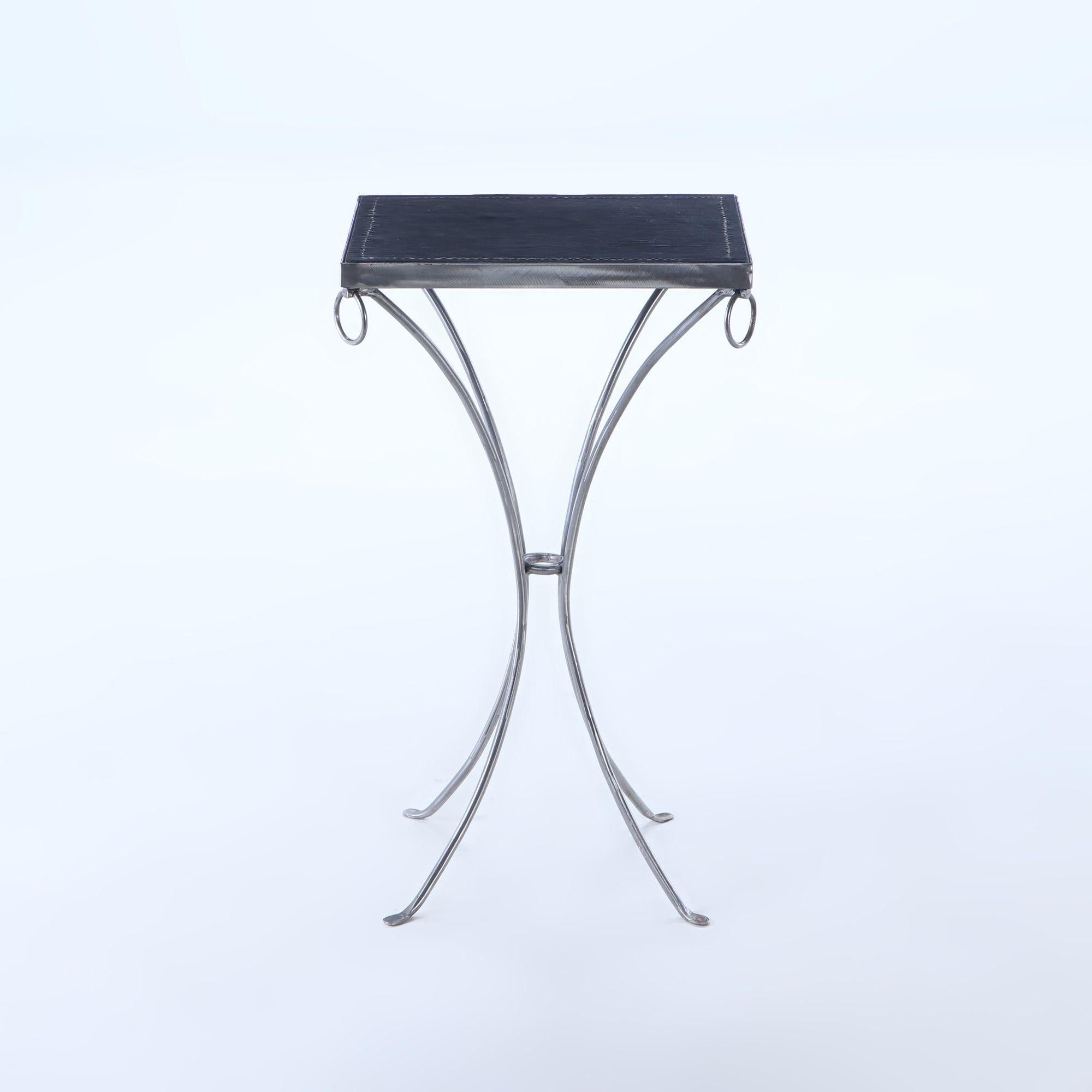 Modern Pair polished iron drinks tables with ring decoration, distressed leather tops For Sale