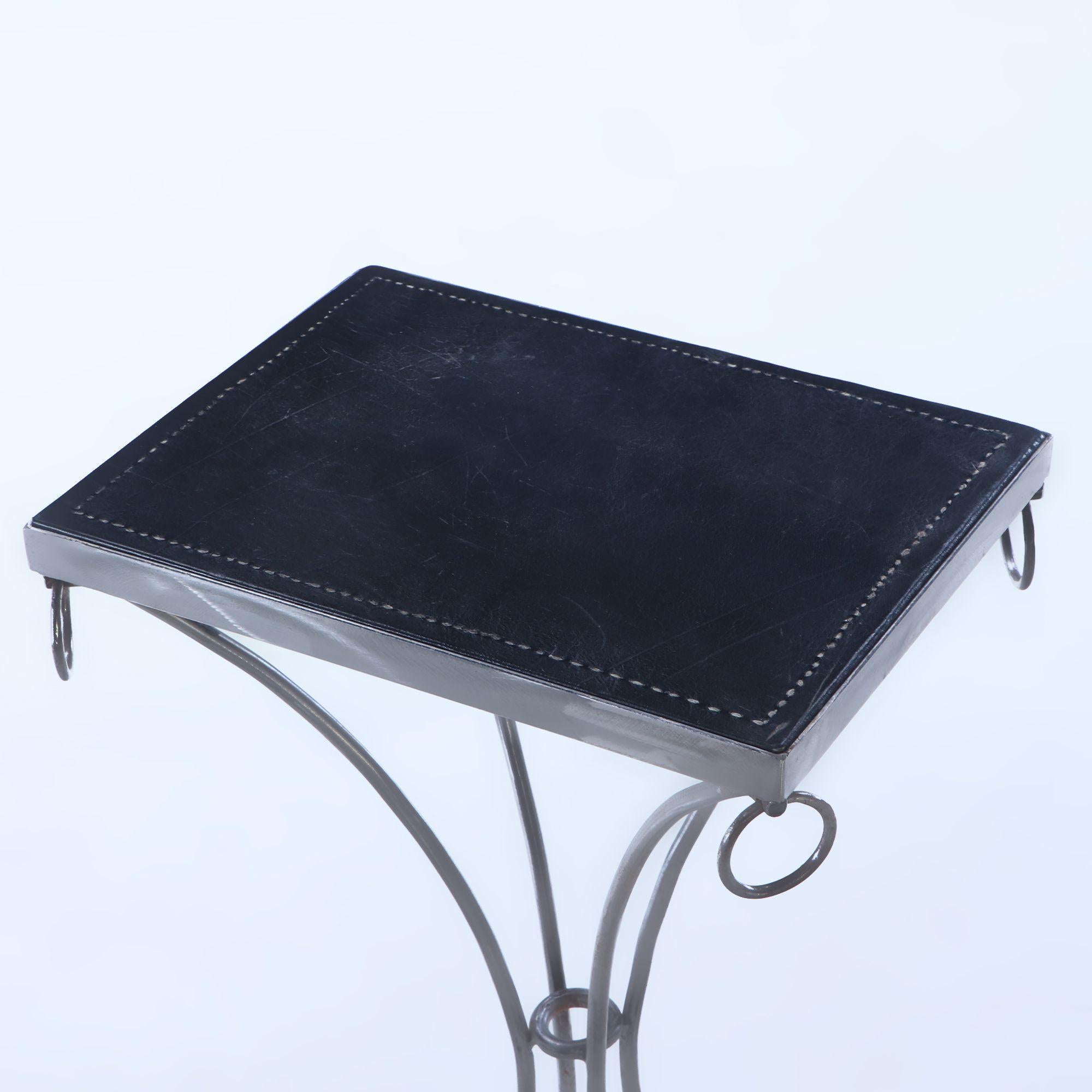 Pair polished iron drinks tables with ring decoration, distressed leather tops For Sale 2