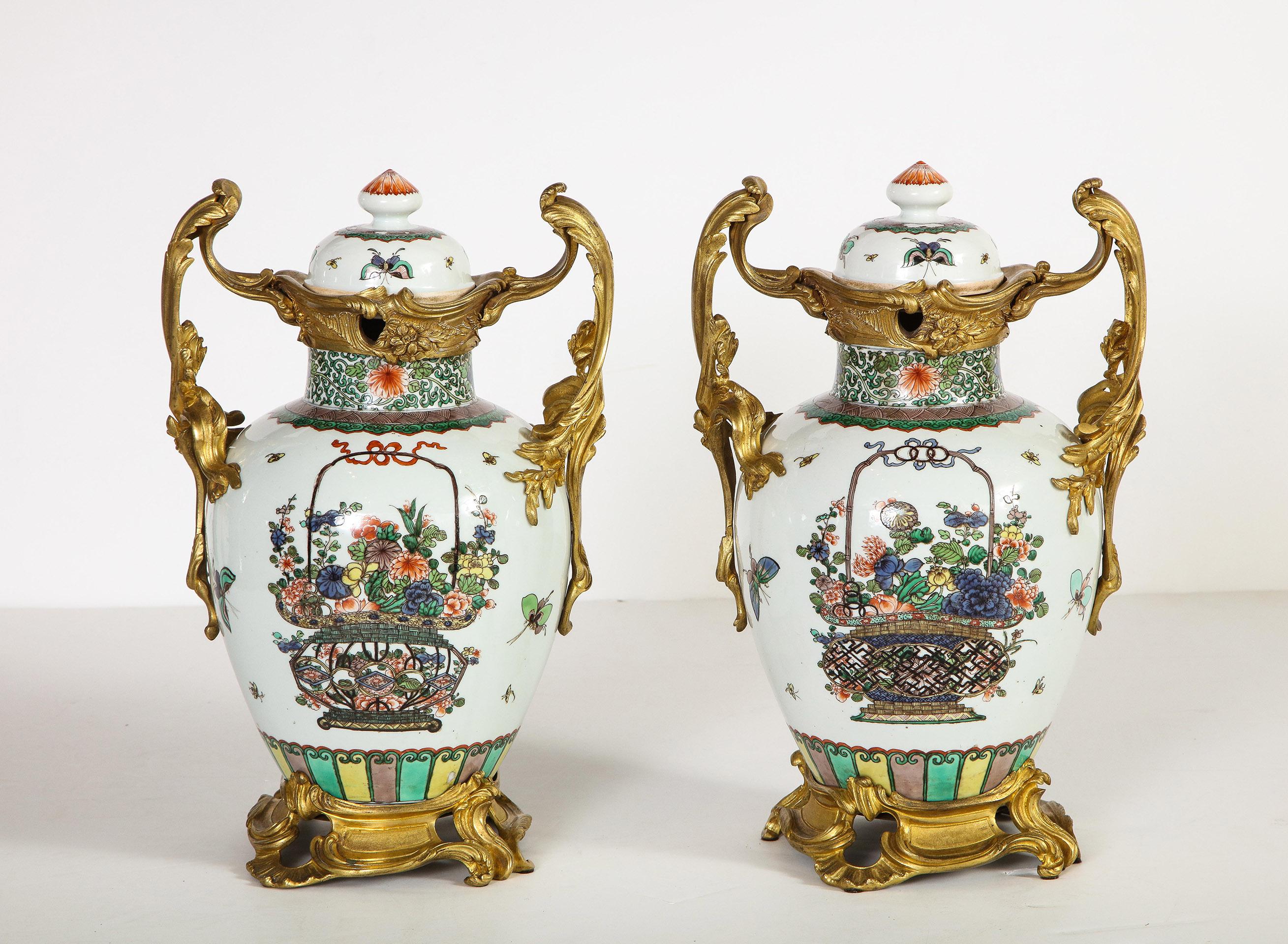 Pair of Louis XVI style Chinese porcelain urns with ormolu mounts

The pair of 19th century Chinese porcelain lidded urns with French Louis XVI style ormolu mounts. Each urn with raised scrolled circular ormolu base. Above the urn with floral