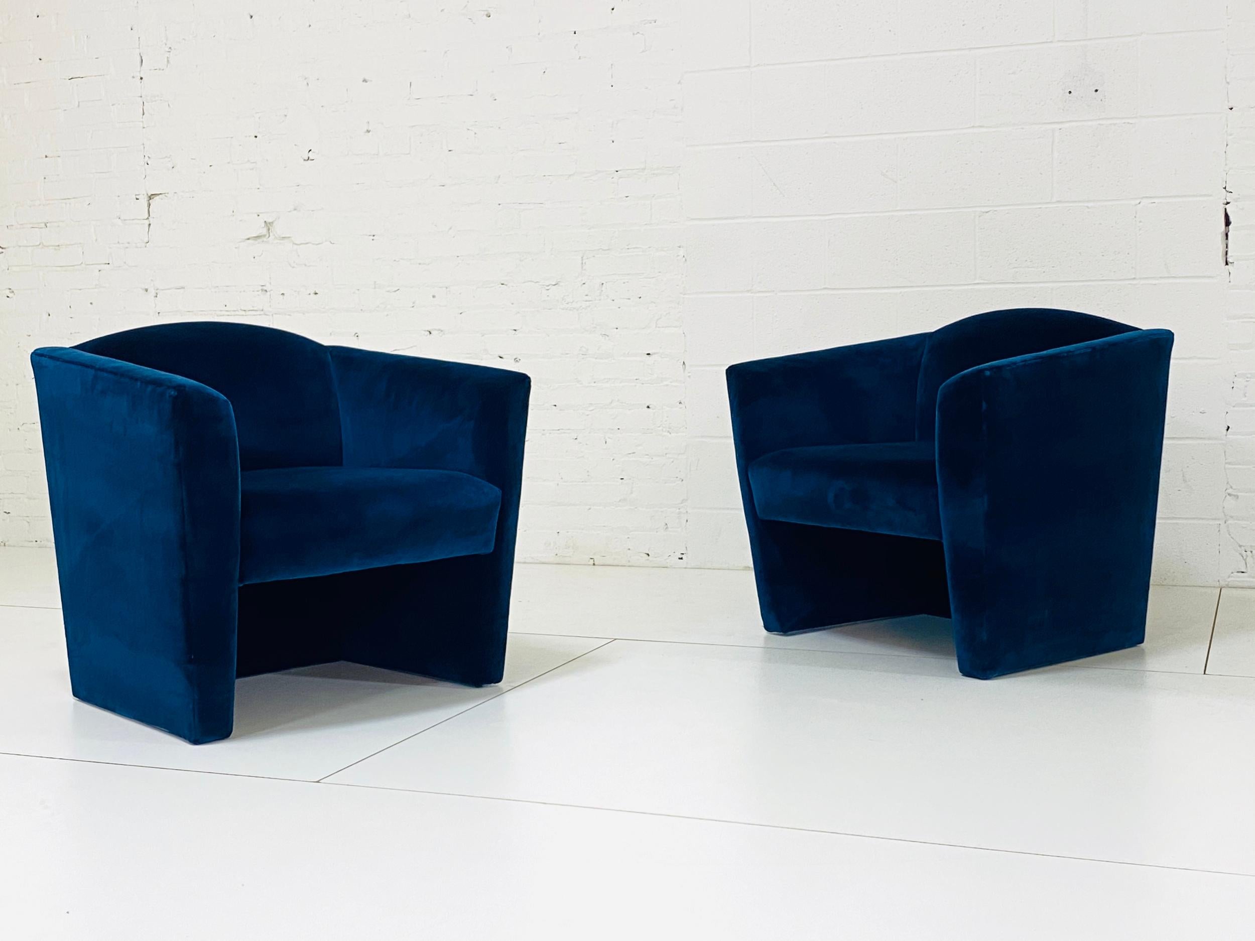 Pair of sculptural Postmodern lounge chairs. Angular barrel back form in newly reupholstered sapphire cotton velvet.