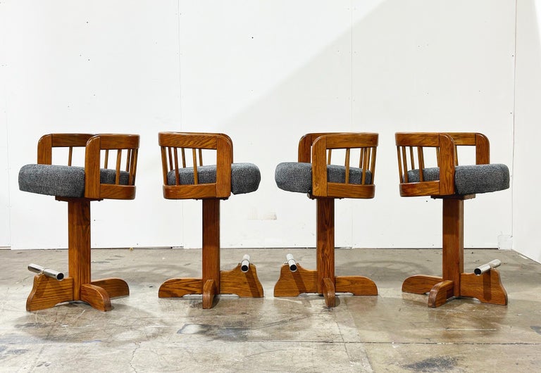 Pair Post Modern Bar Stools, Counter Height Swivel, Solid Oak After Lou Hodges For Sale at 1stDibs