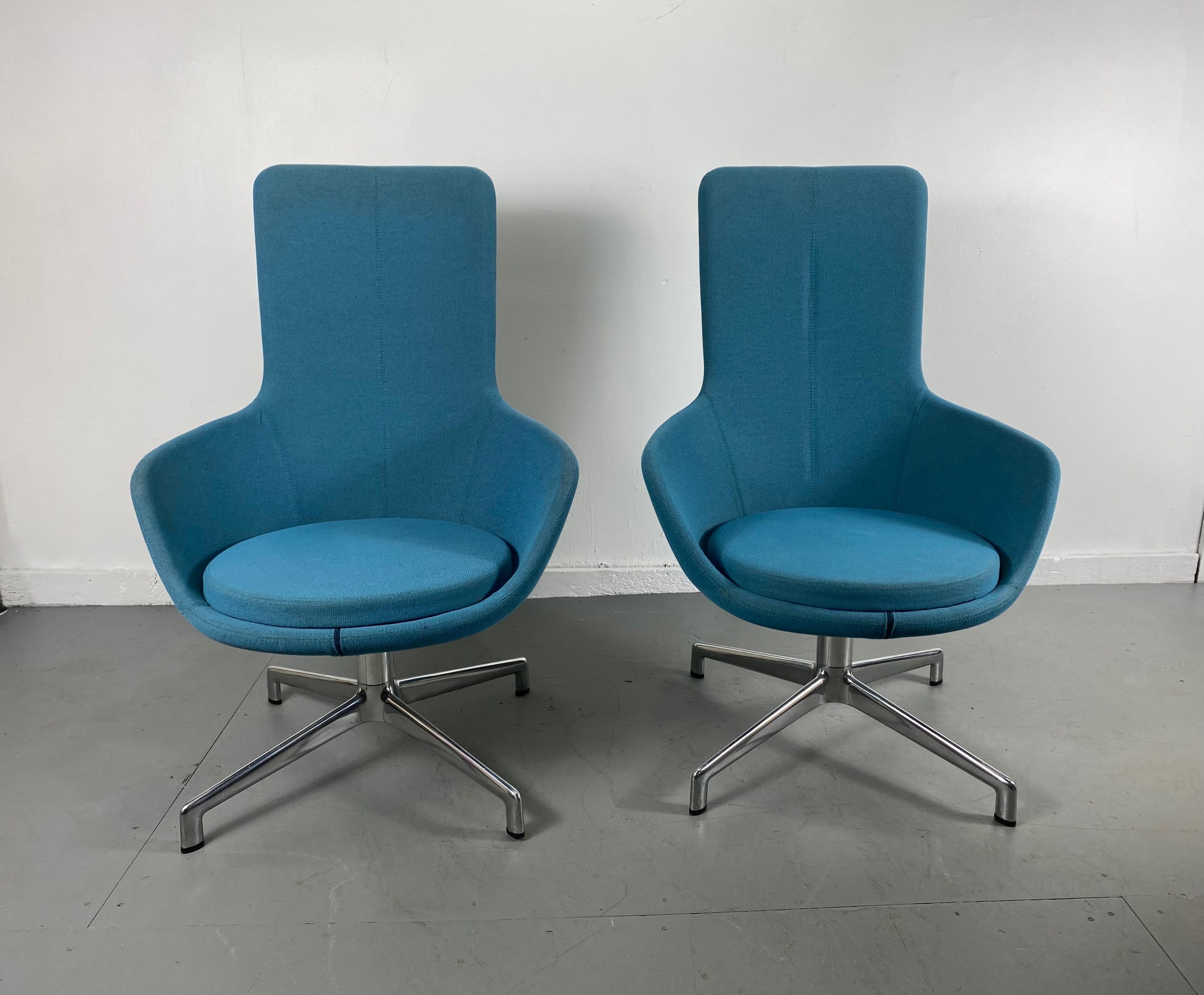 Pair of post modernist lounge chairs, Juxta chair by Keilhauer. Designed after iconic designs by Arne Jacobsen, Egg, Swan etc. Extremely comfortable, amazing color, proportions, superior quality and construction, hand delivery avail to New York City