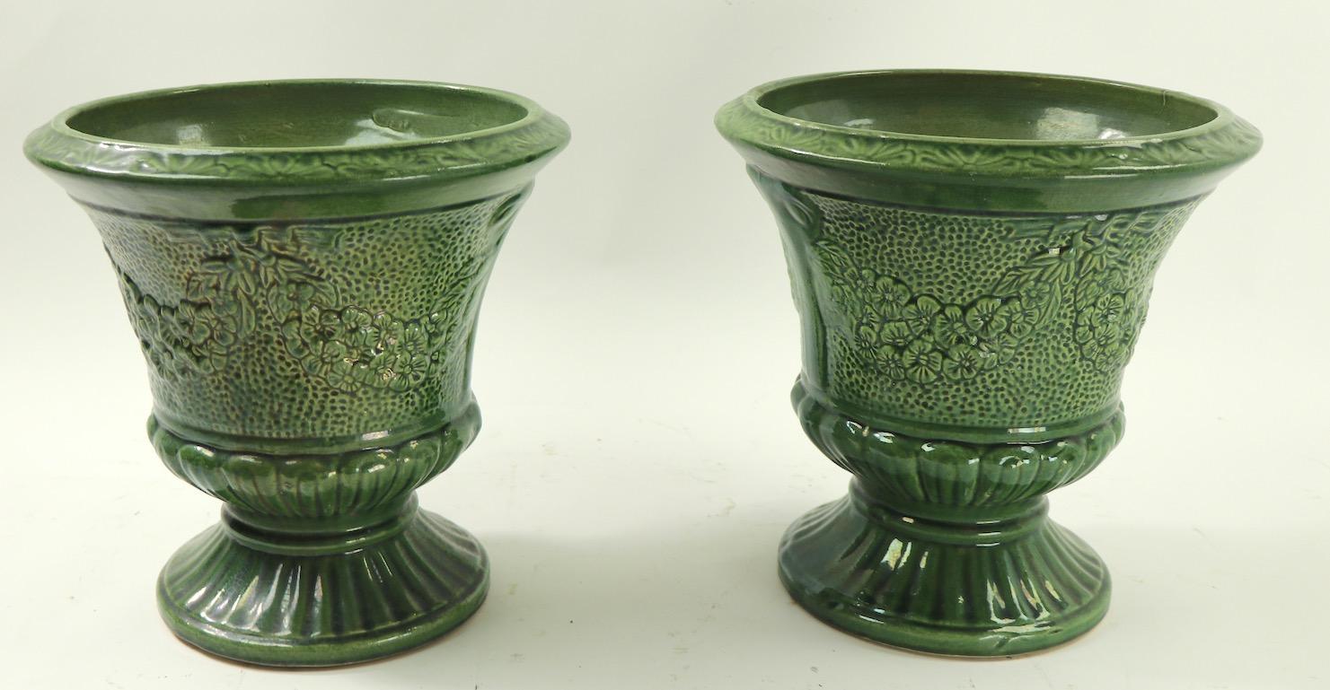 Pair of vintage green glaze pottery urns, unsigned, possibly Zanesville, McCoy, or Robinson Ransbottom, American made probably from Ohio. Both urns are in great condition, free of damage or repairs. Nice large scale, suitable for either indoor or